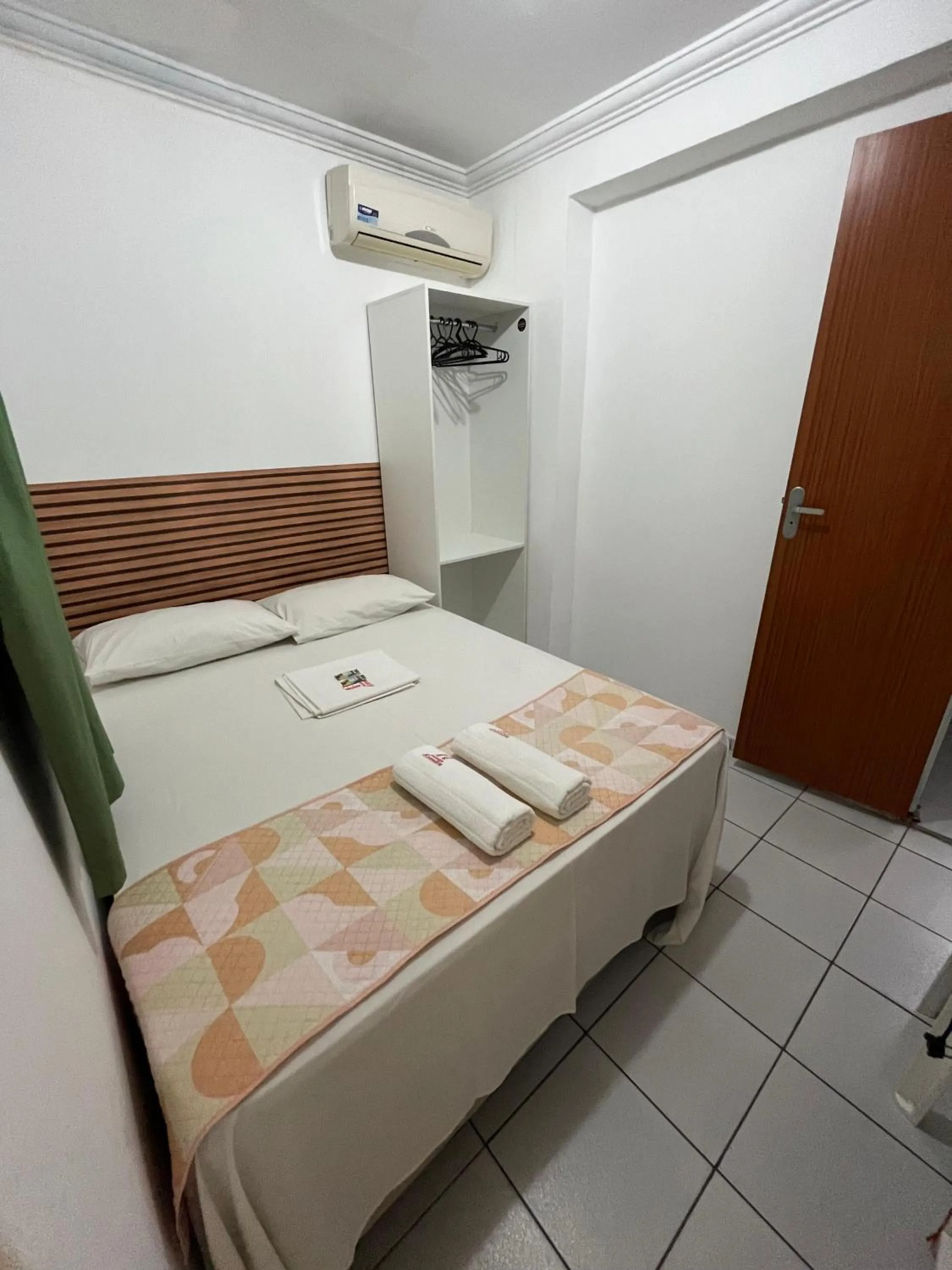 Bed in Pousada Executiva