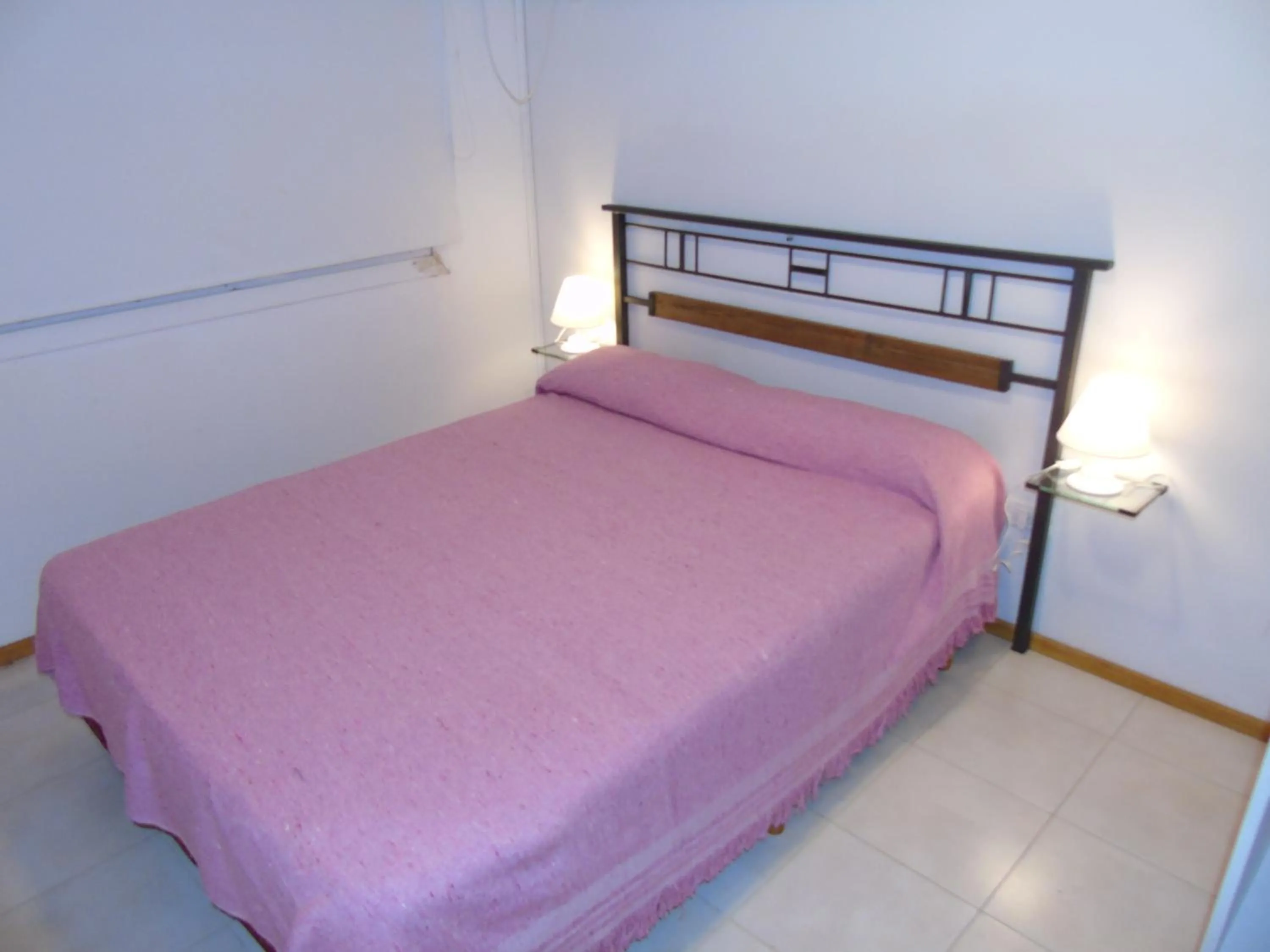Bed in Aitue Bungalows