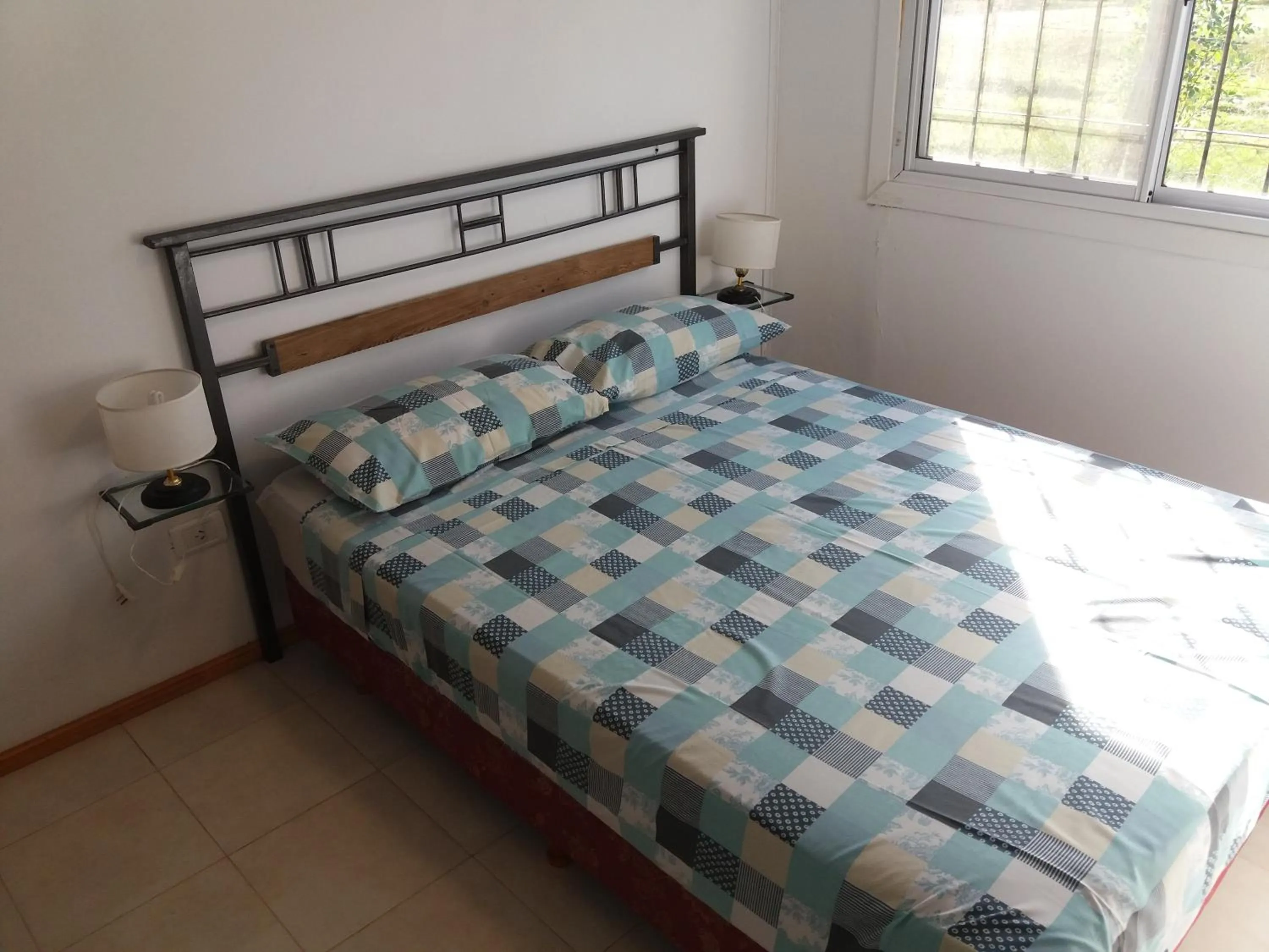 Bed in Aitue Bungalows