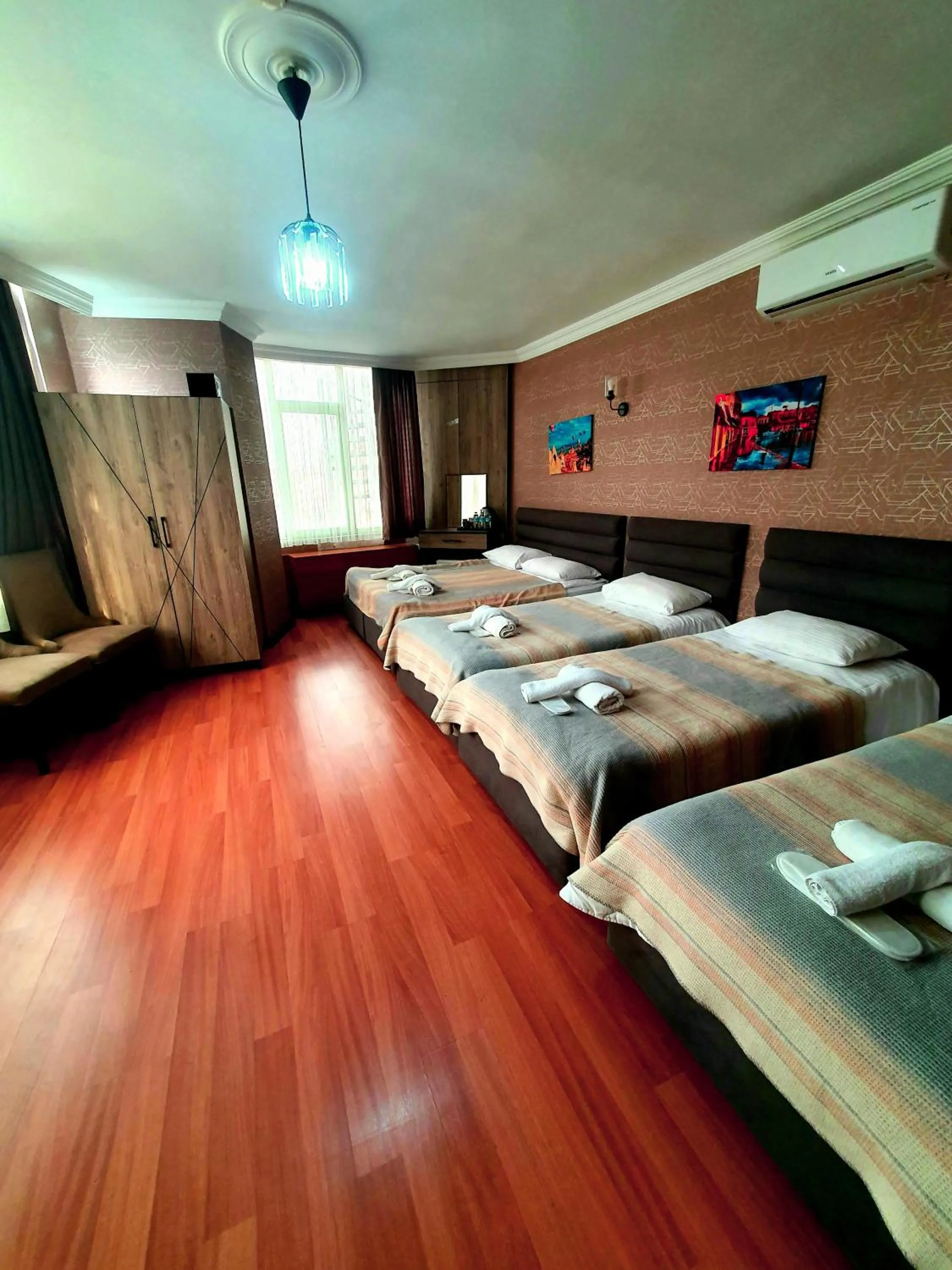 Bed in Omega Luxx Hotel