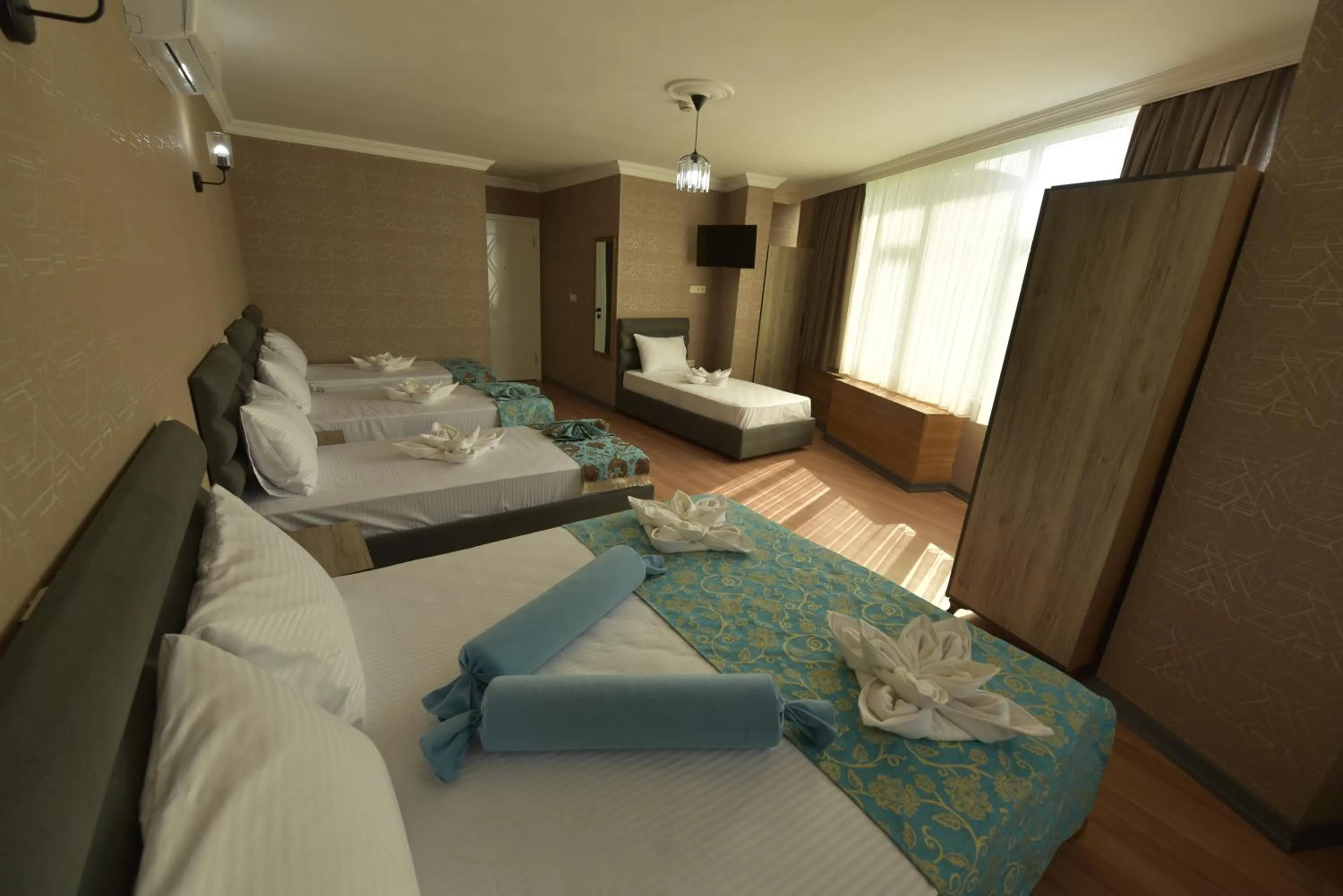 Bed in Omega Luxx Hotel