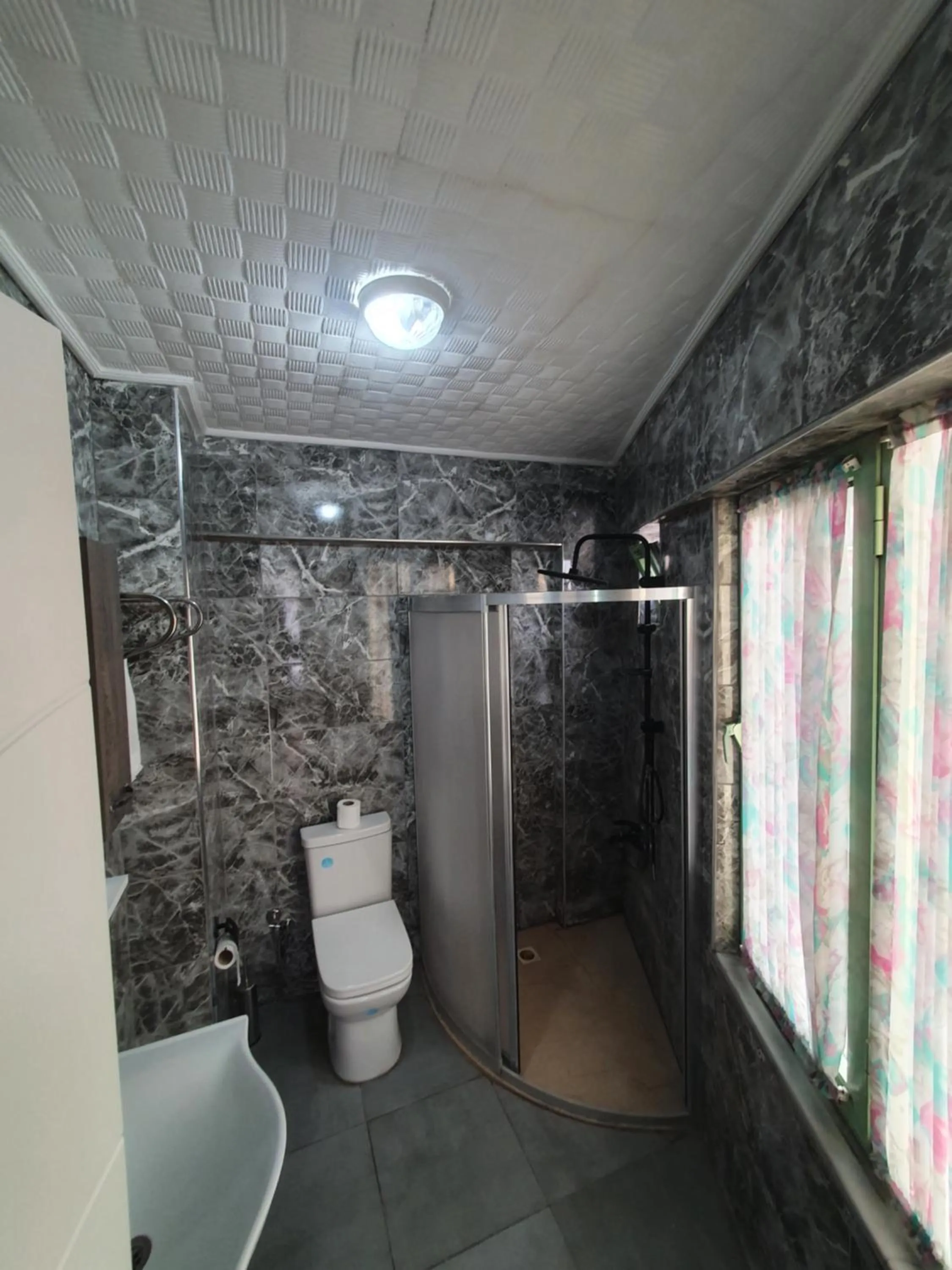 Bathroom in Omega Luxx Hotel