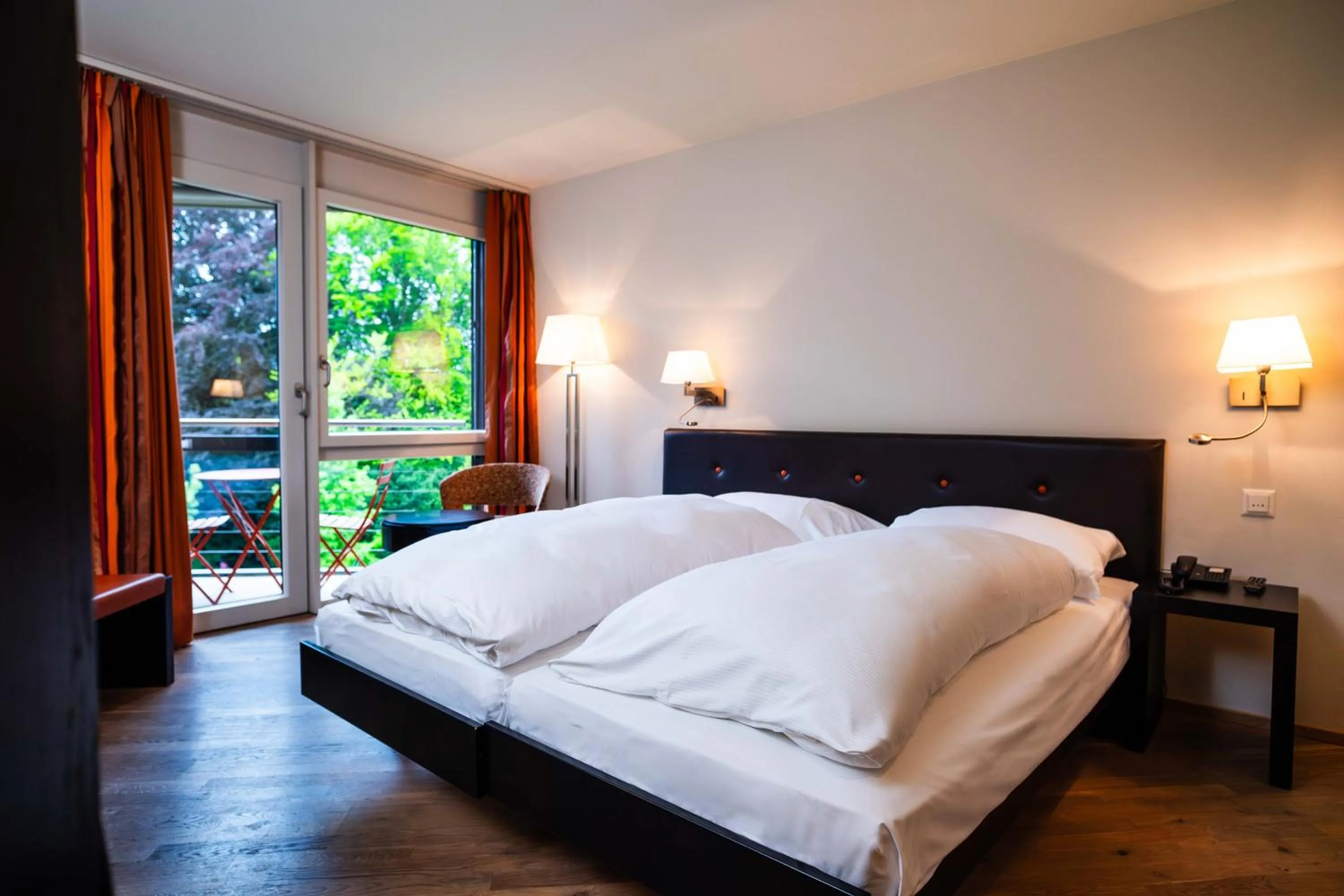 Photo of the whole room, Bed in Hotel Seepark Thun