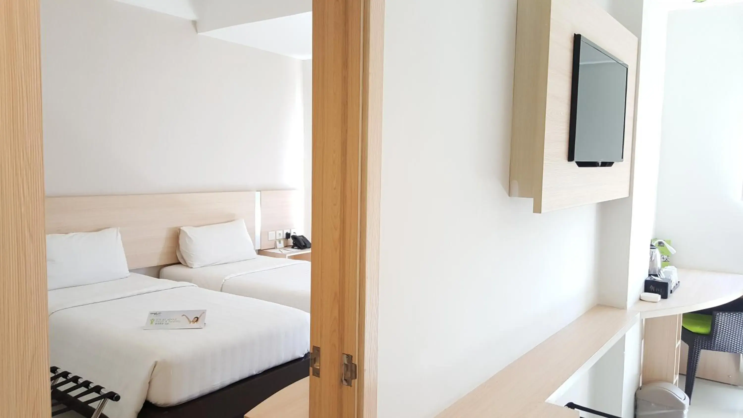 Bed in Whiz Prime Hotel Sudirman Makassar Bed in Whiz Prime Hotel Sudirman Makassar