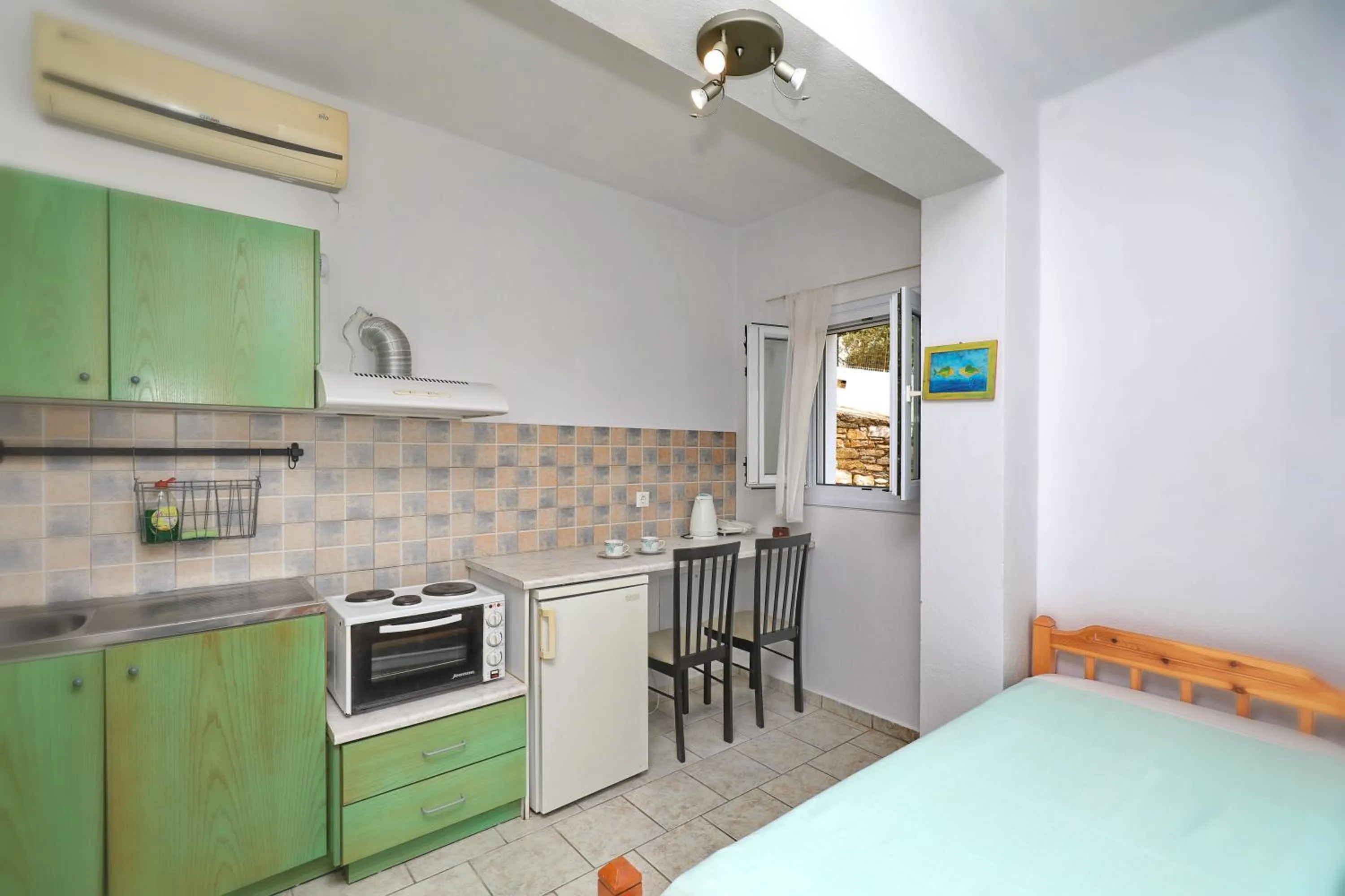 Kitchen or kitchenette, Bed in Liofoto
