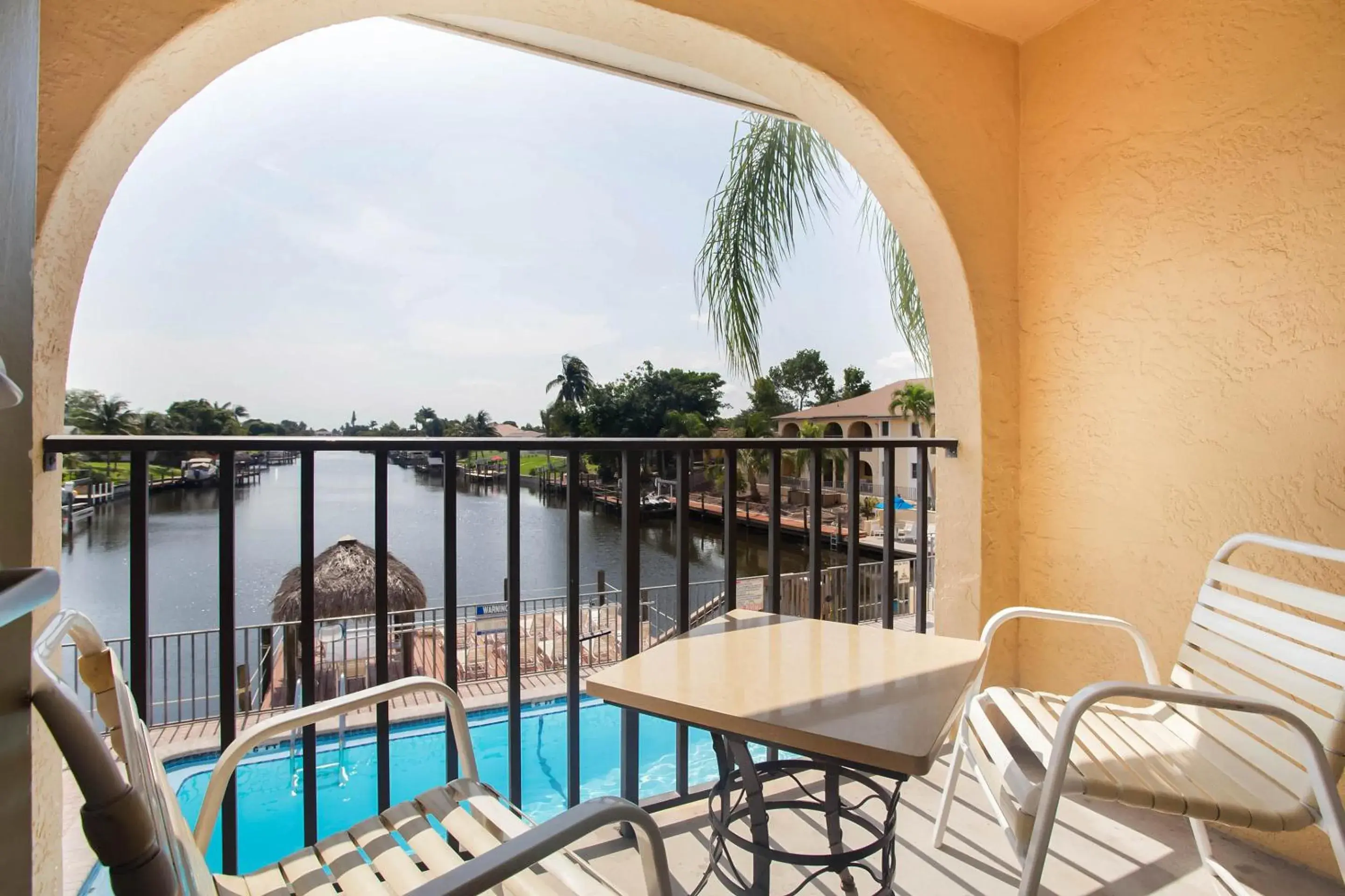 Balcony/Terrace, Pool View in OYO Waterfront Hotel- Cape Coral Fort Myers, FL