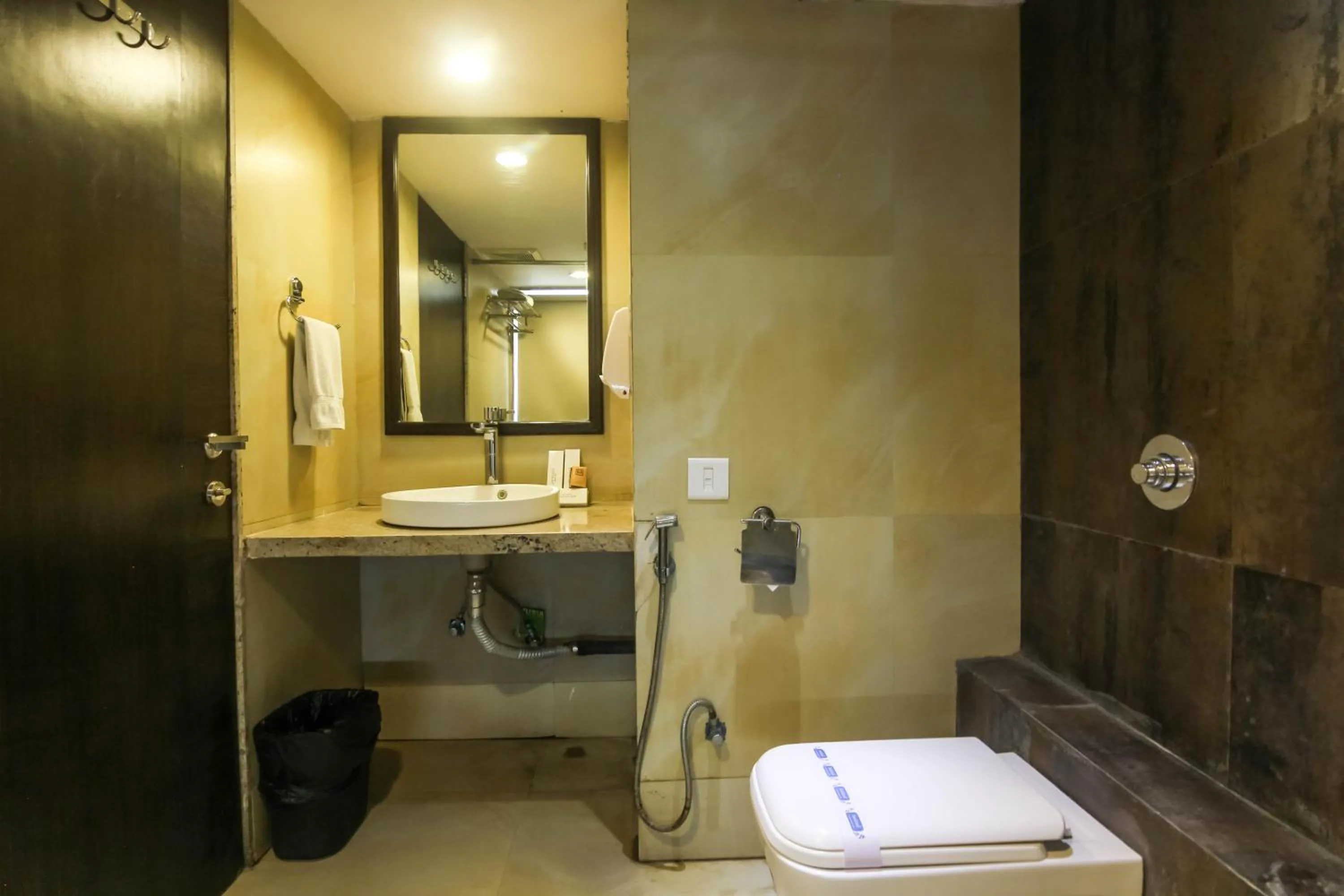 Bathroom in Hotel LXIA Hinjewadi - Indian Nationals Only