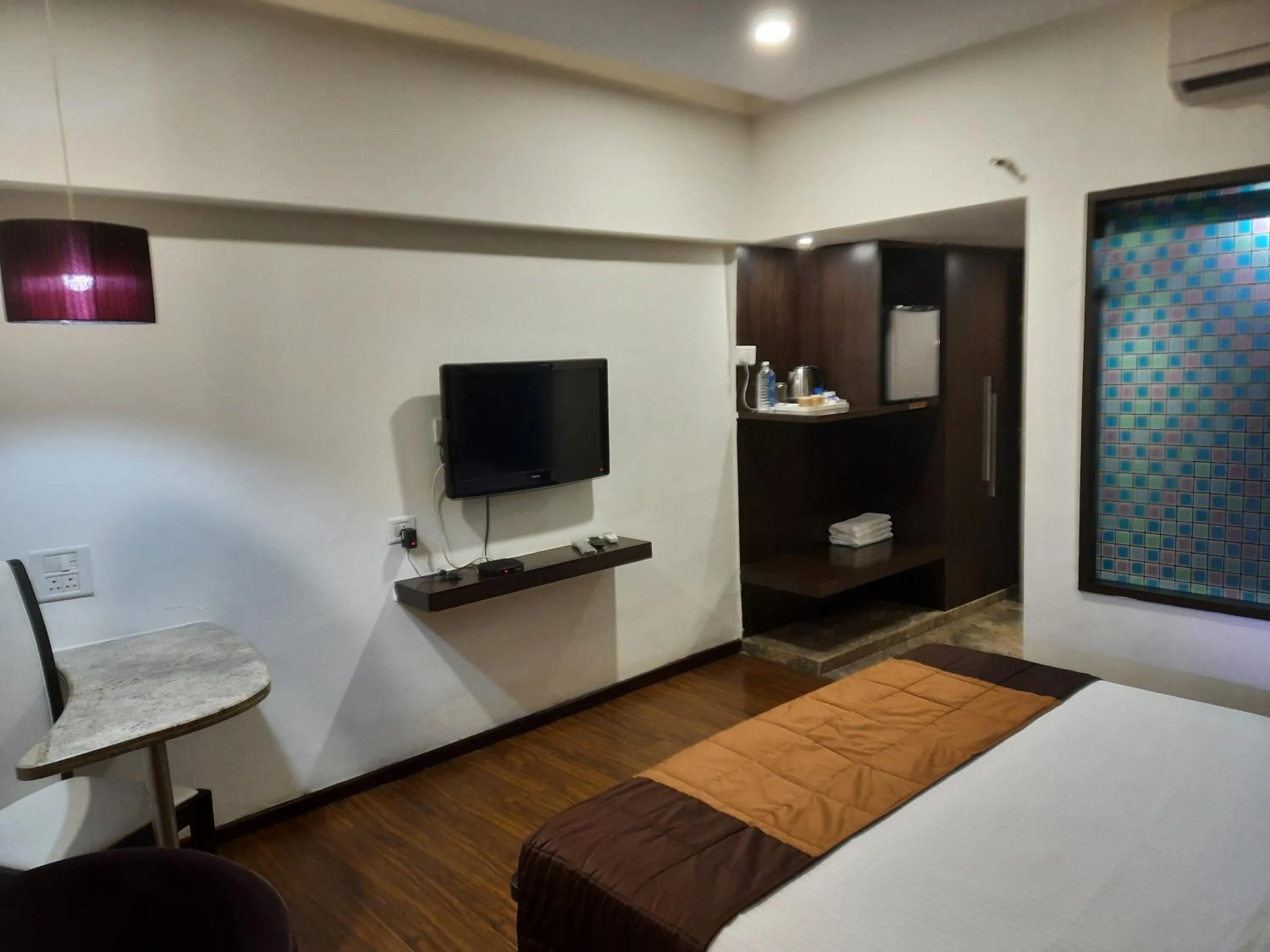 Communal lounge/ TV room, Bed in Hotel LXIA Hinjewadi - Indian Nationals Only