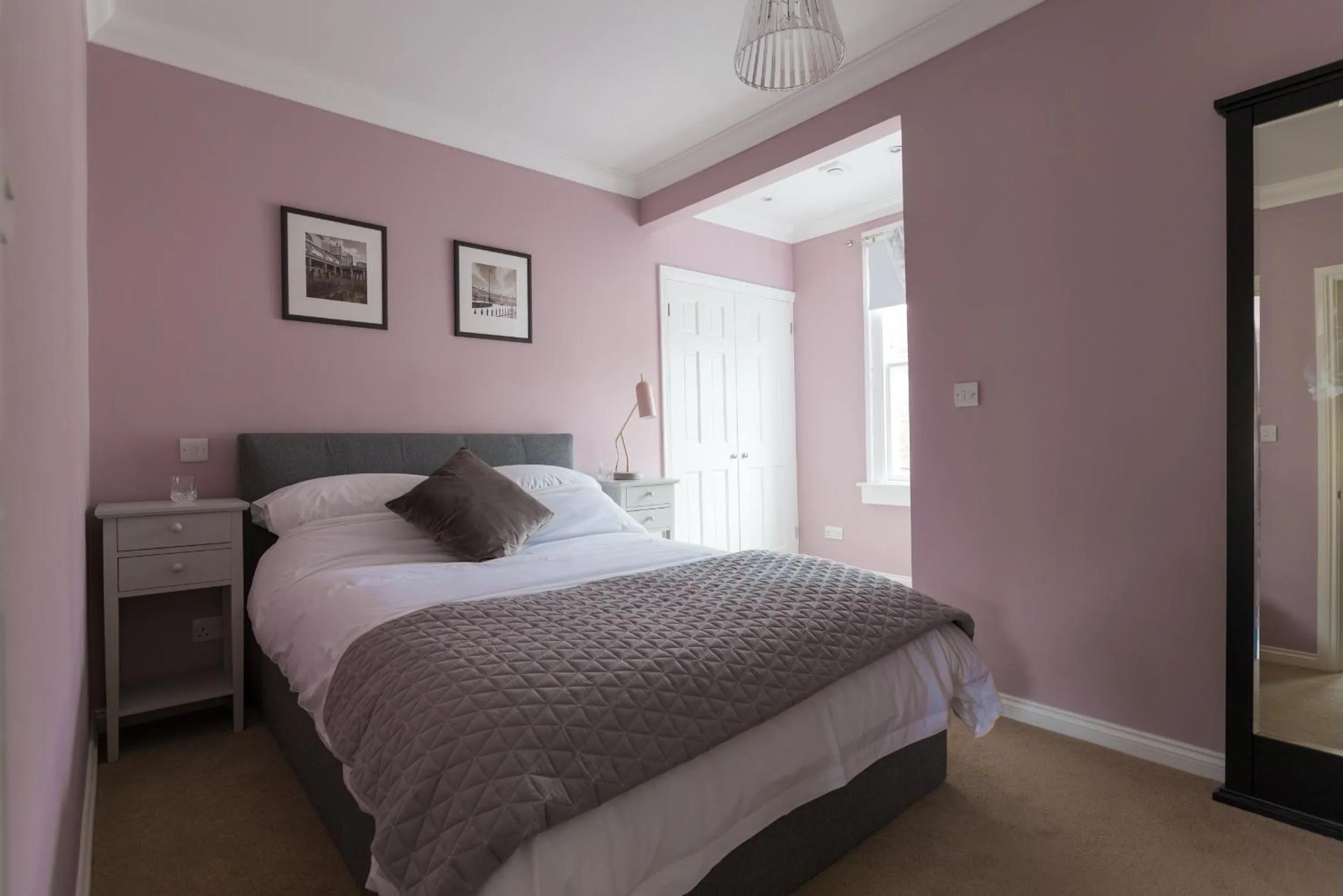 Bed in Vesta Central Bath Apartment