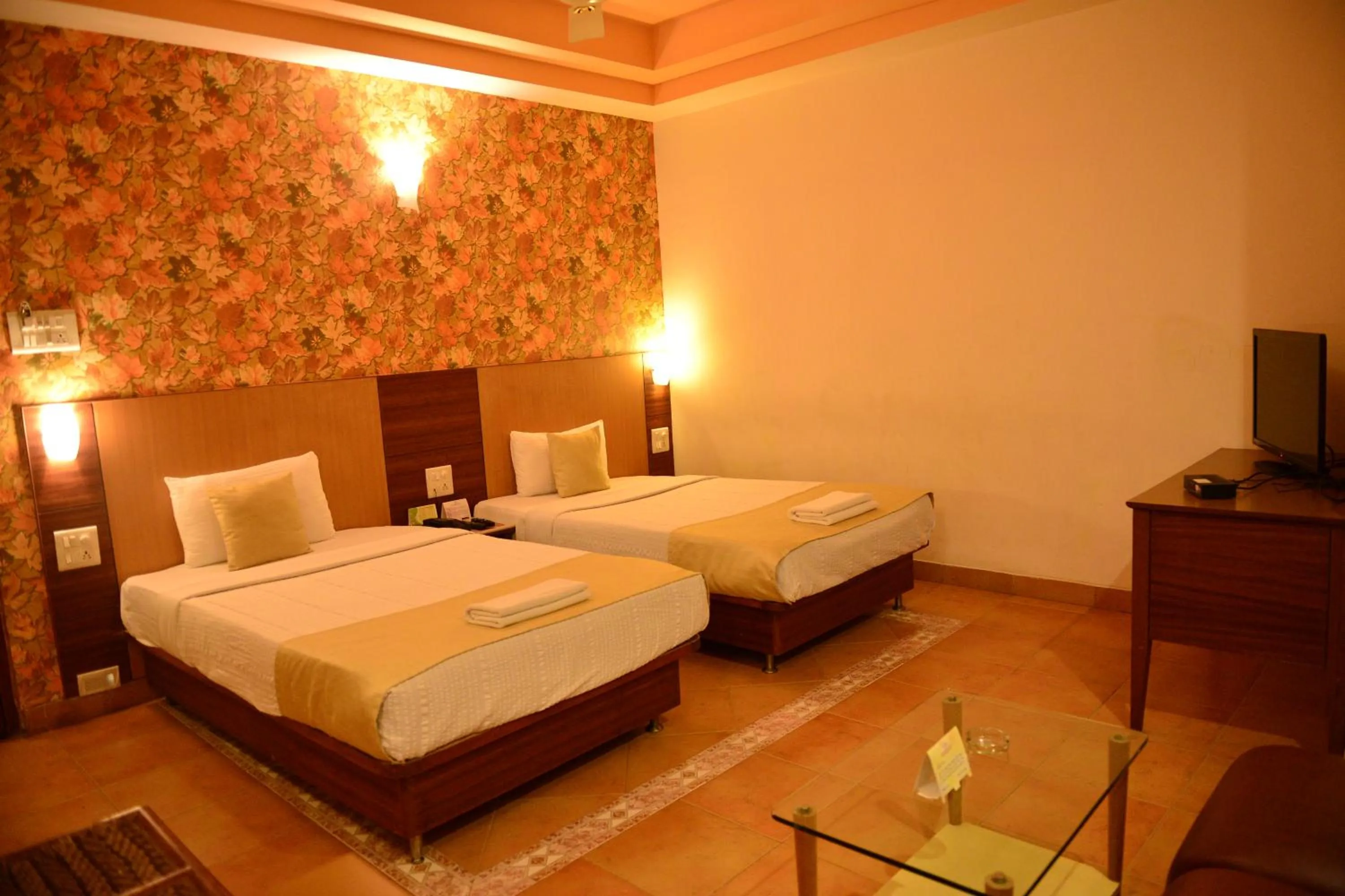 Bed in Goa Woodlands Hotel