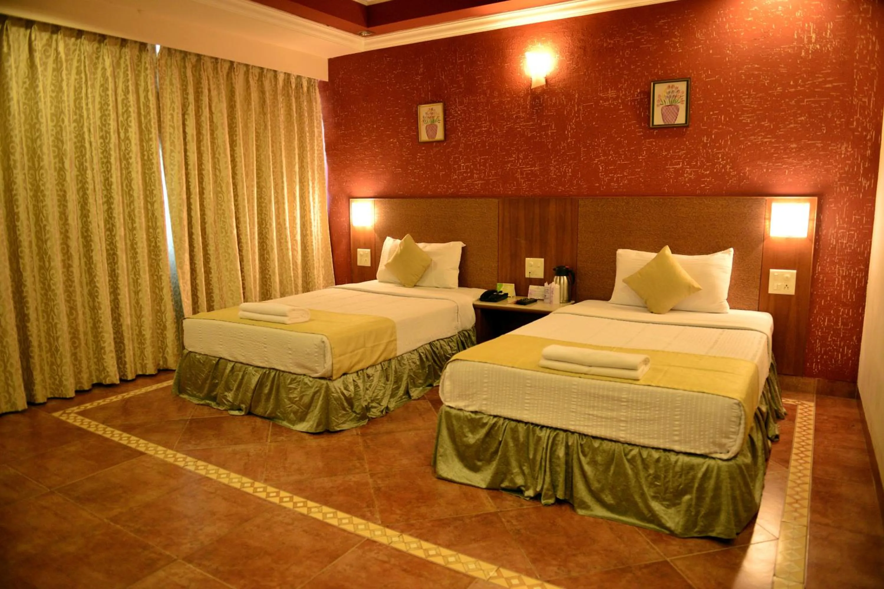 Bed in Goa Woodlands Hotel