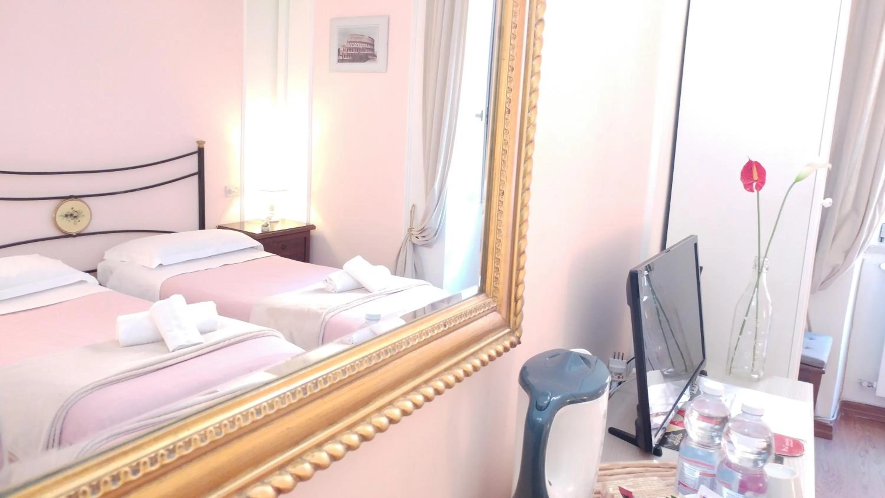 Decorative detail, Bed in Dreaming Navona Rooms