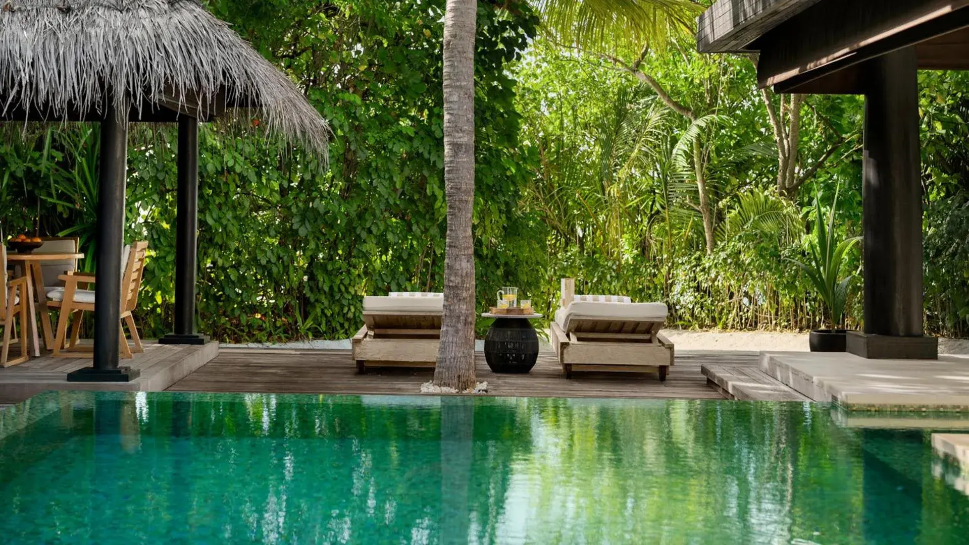 Swimming pool in Naladhu Private Island Maldives Swimming pool in Naladhu Private Island Maldives