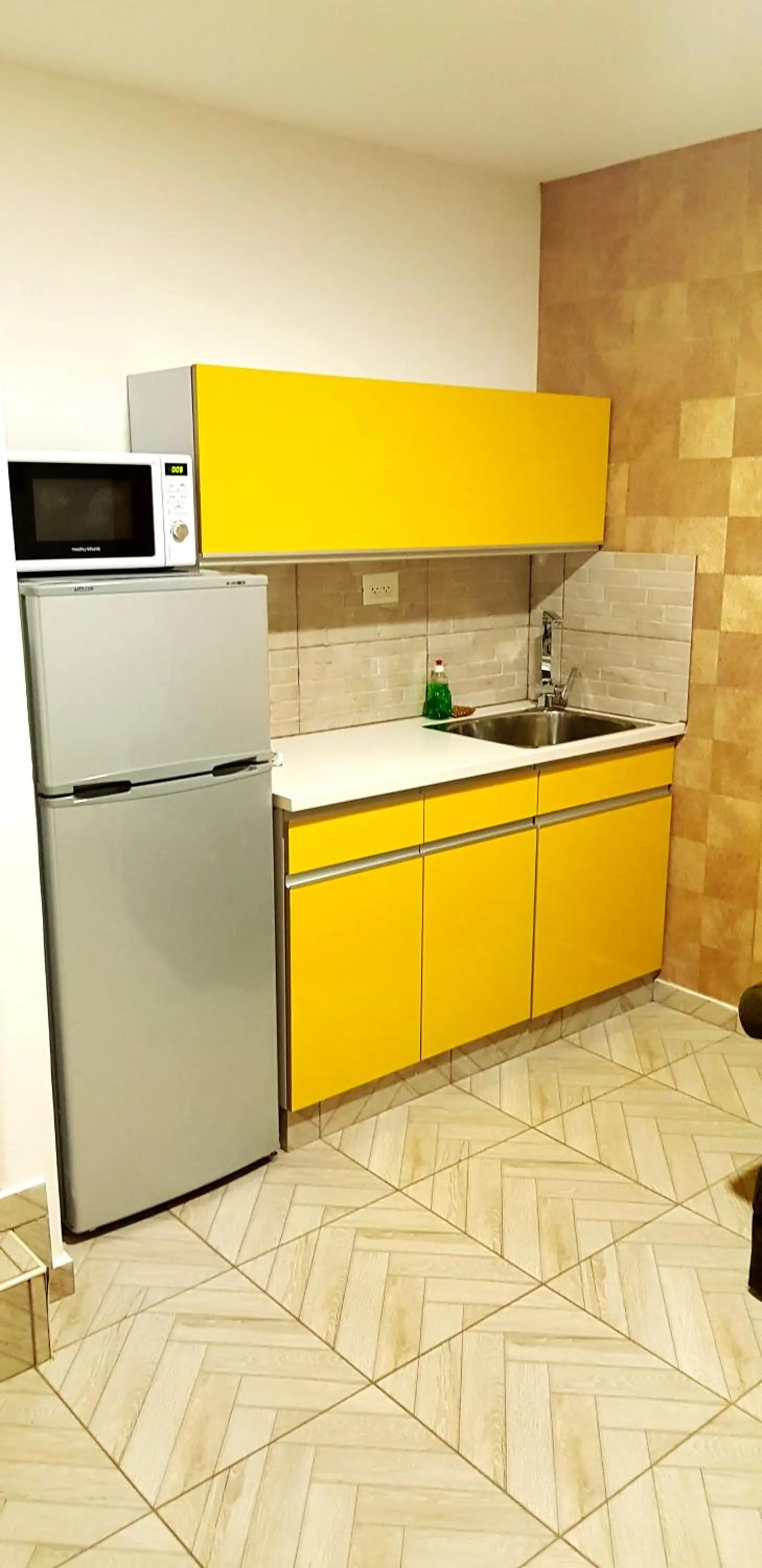Kitchen or kitchenette in City Suites