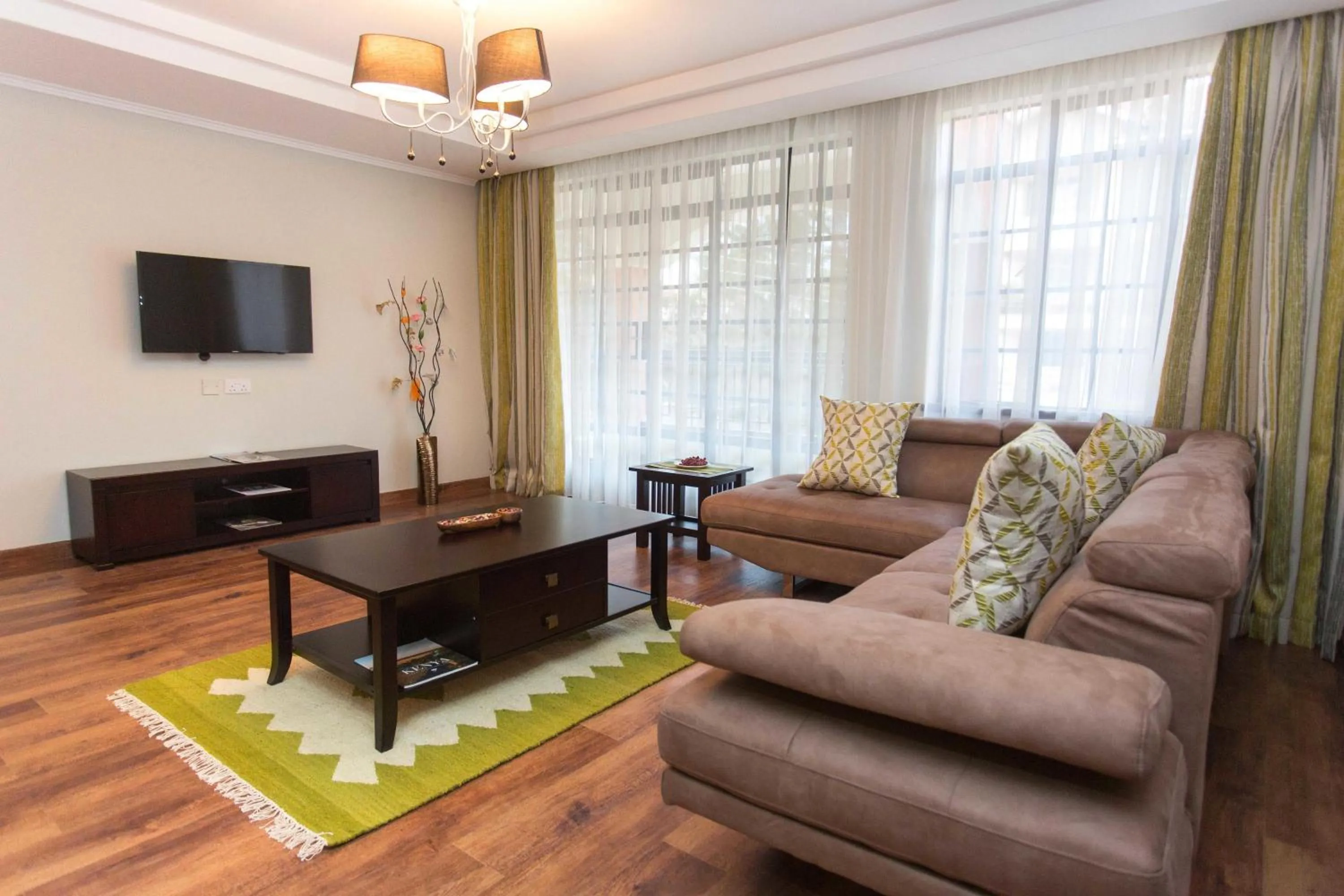 Living room in Cozy Residences by Trianum