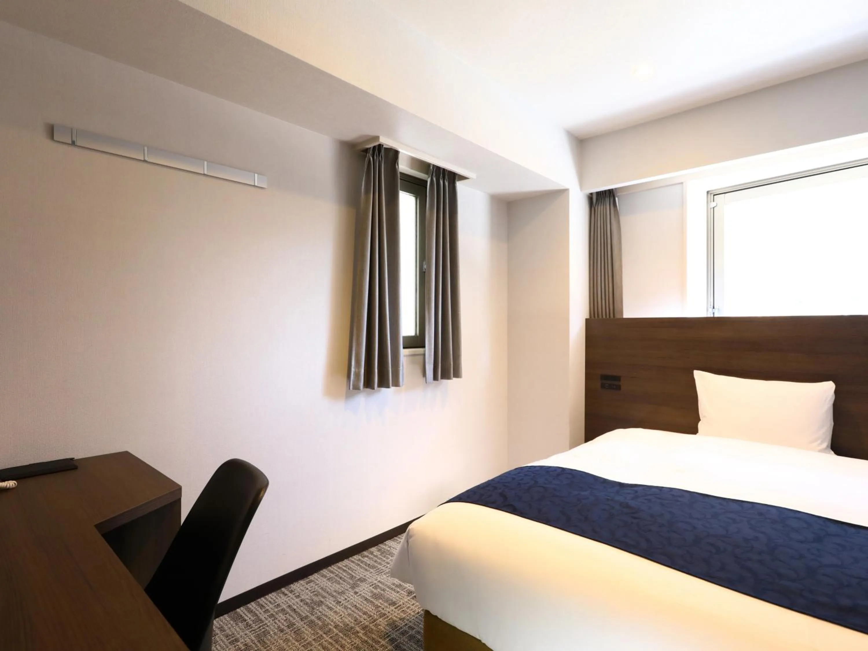 Bed in KOKO HOTEL Ikebukuro East - formerly Hotel Wing International Ikebukuro