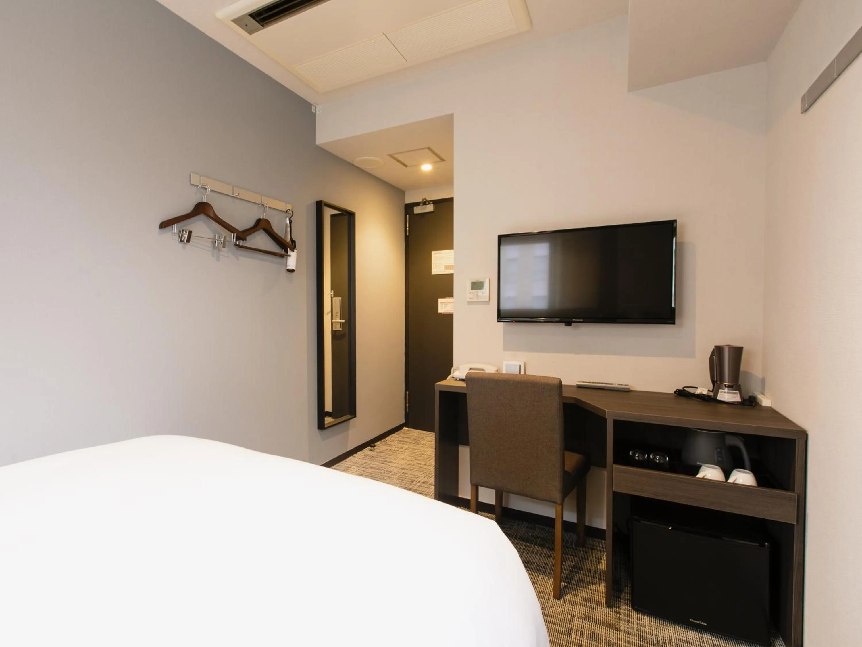 Bed in KOKO HOTEL Ikebukuro East - formerly Hotel Wing International Ikebukuro