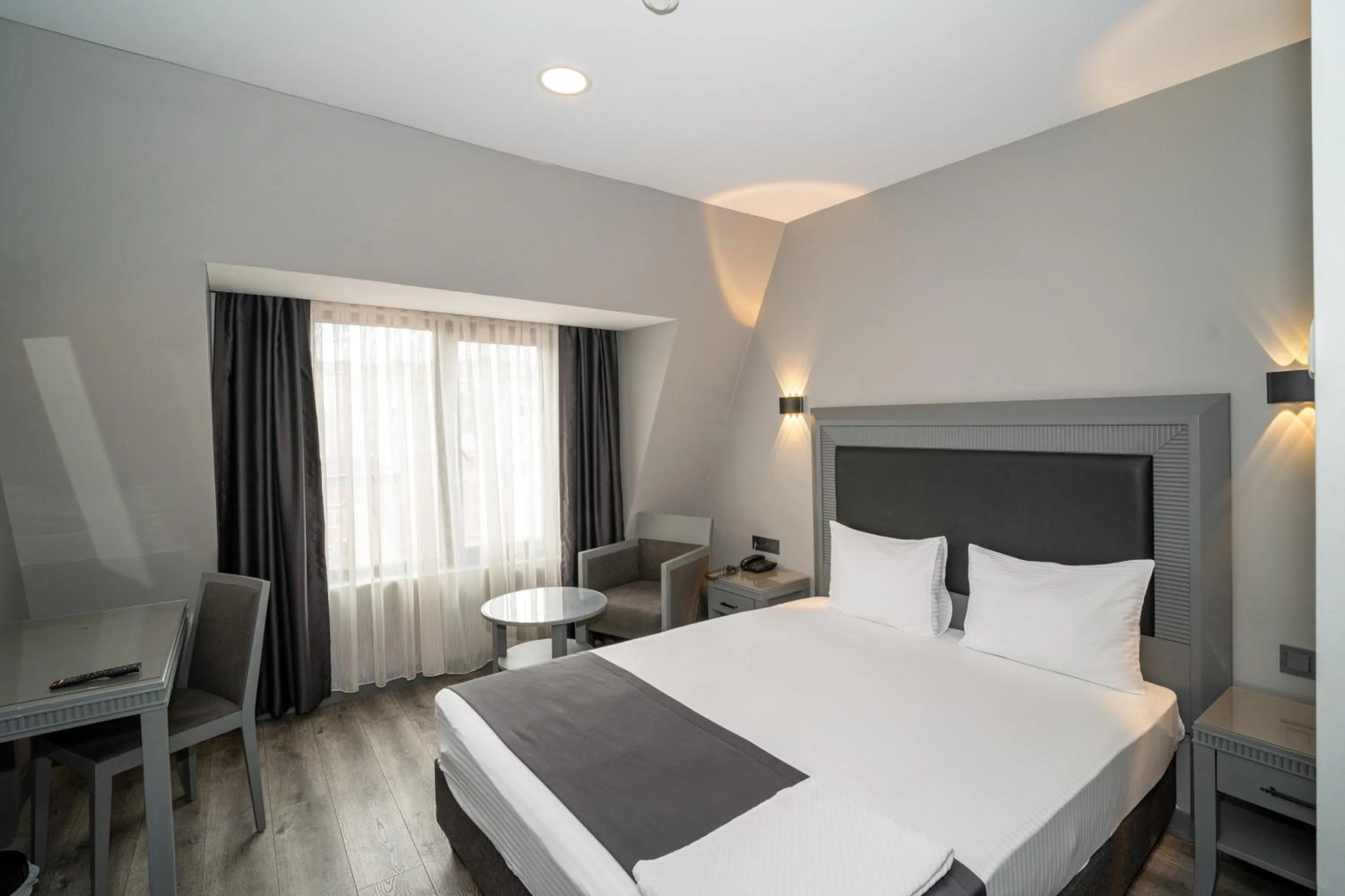 Bed in Grand S Hotel