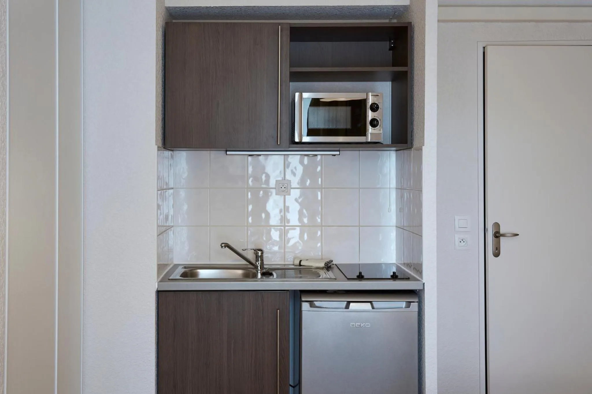 Kitchen or kitchenette in Aparthotel Adagio Access Poitiers