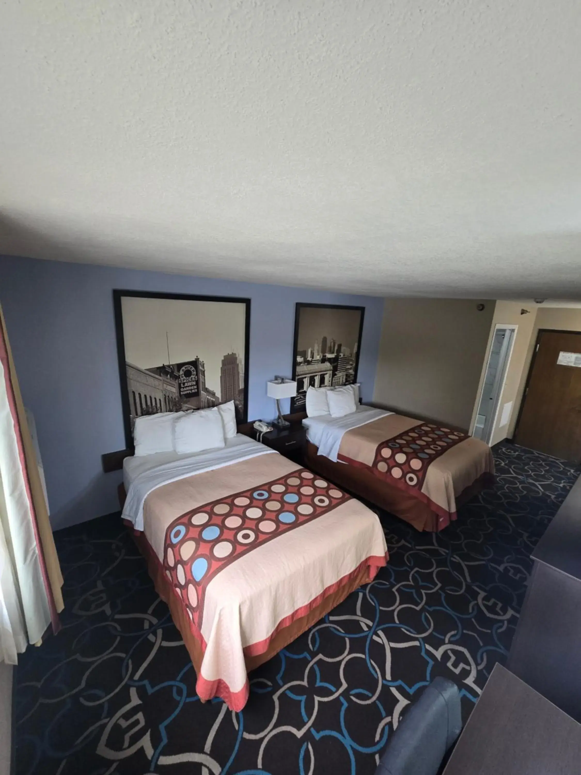 Guests, Bed in Super 8 by Wyndham Kansas City Guests, Bed in Super 8 by Wyndham Kansas City