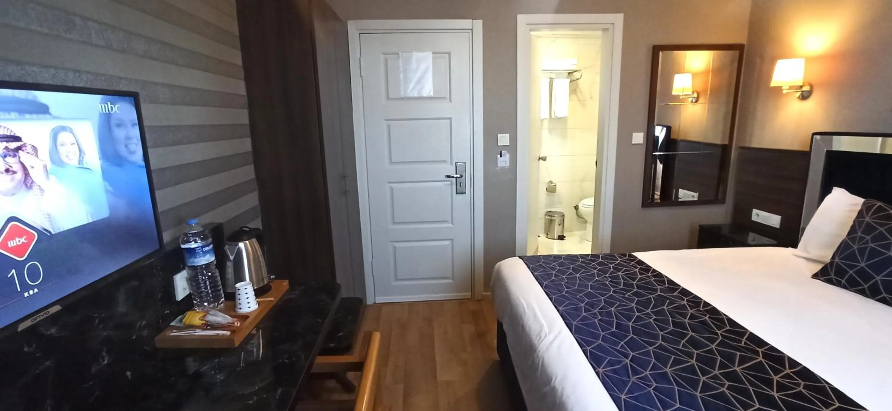 Bed in Star City Hotel