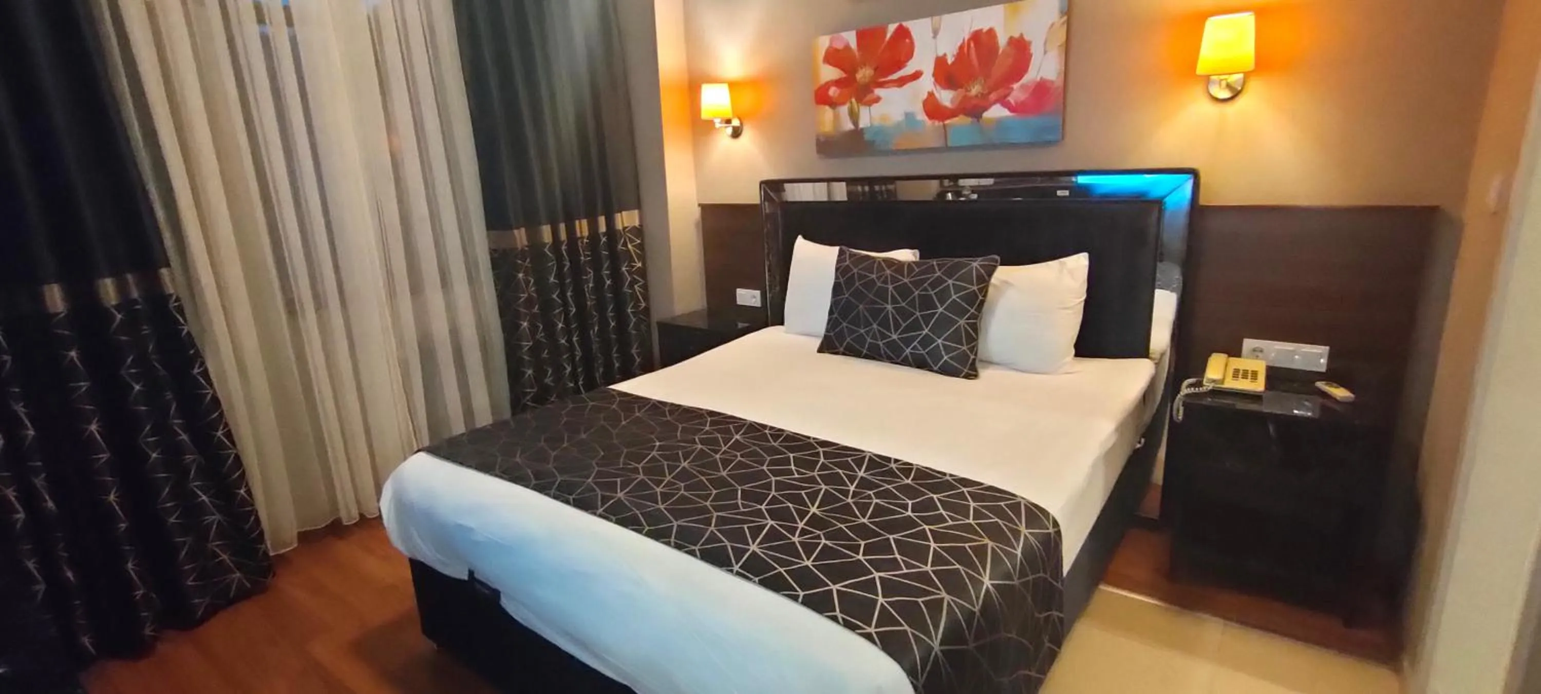 Bed in Star City Hotel