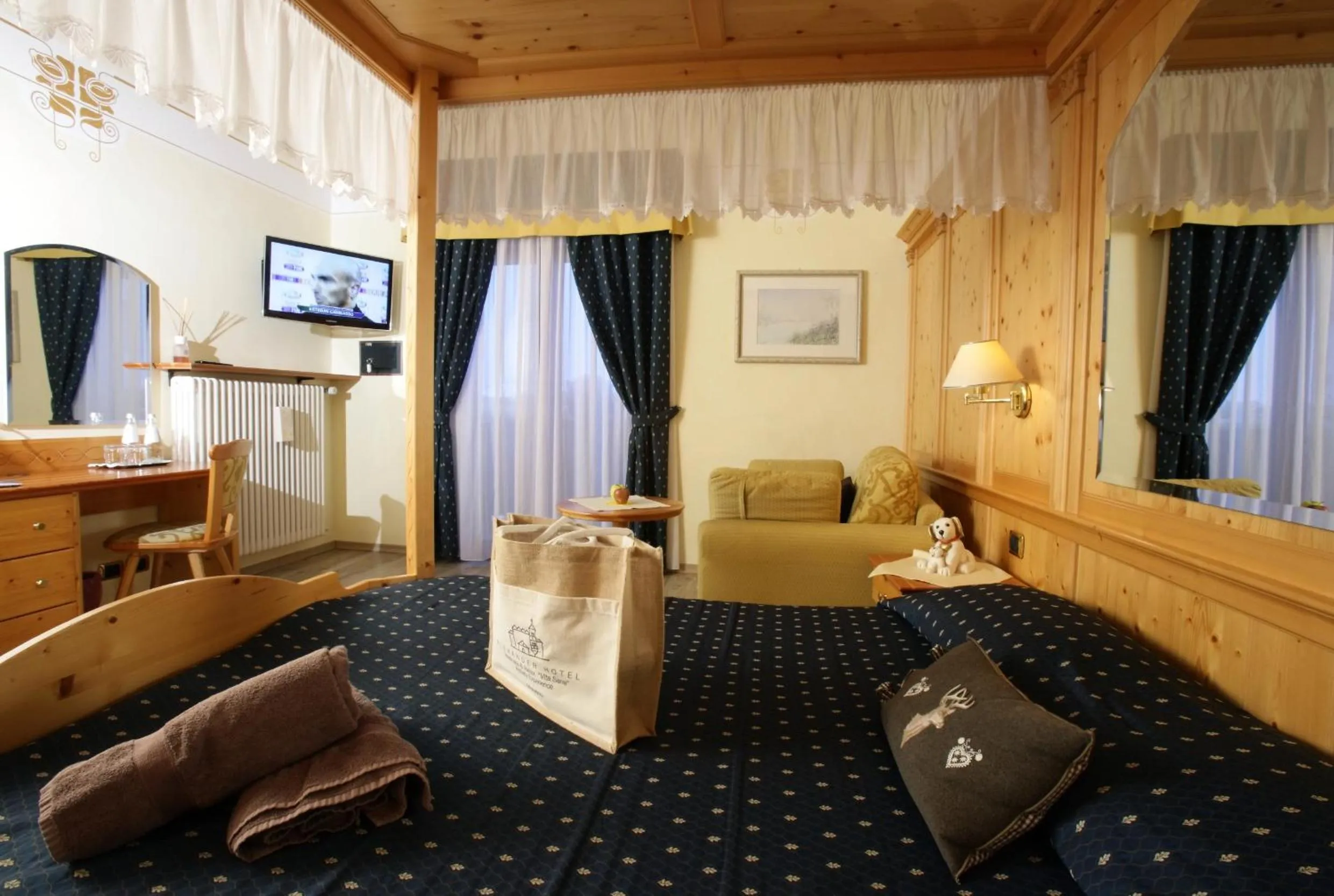 Photo of the whole room, Bed in Alexander Hotel Alpine Wellness Dolomites