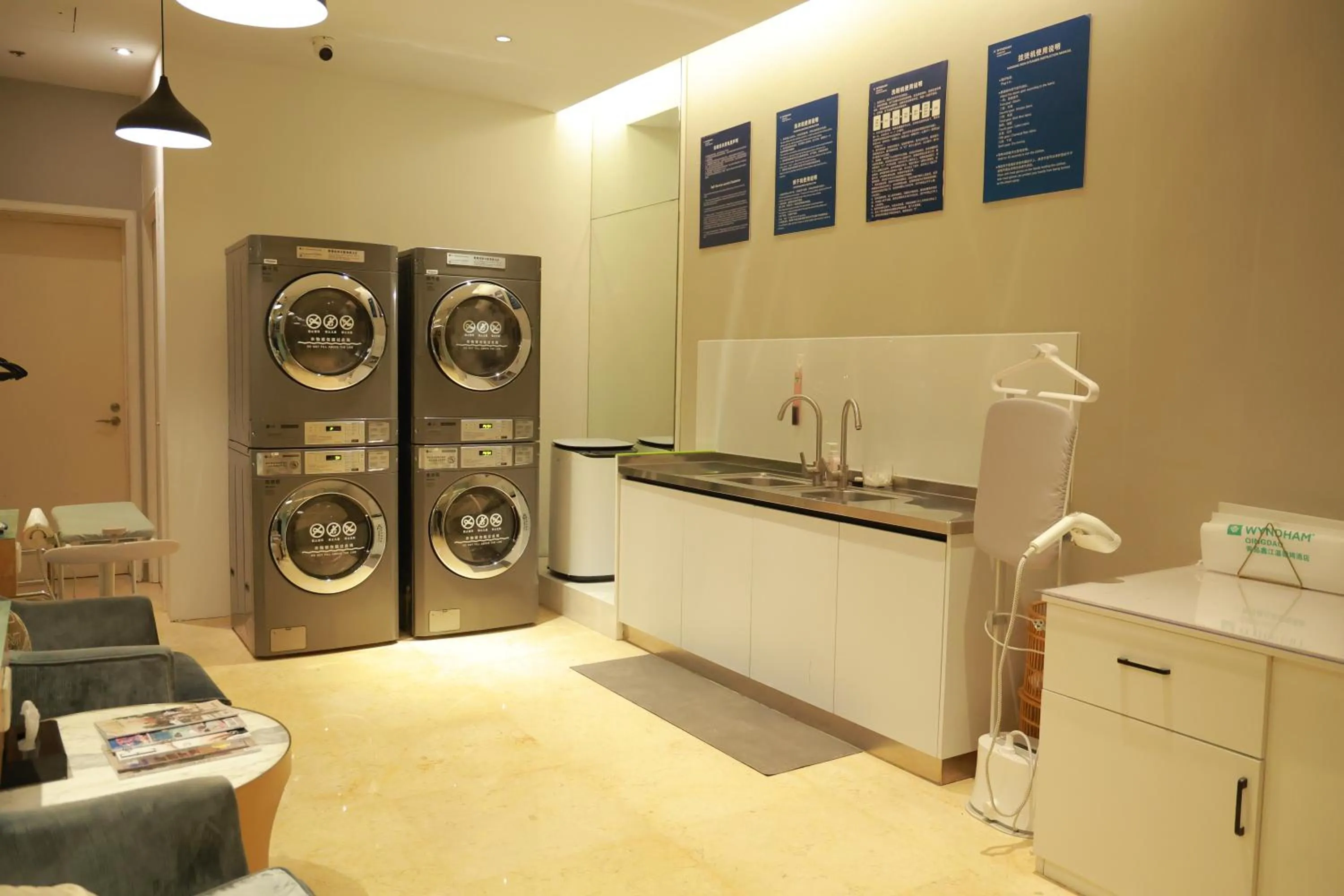 washing machine in Wyndham Qingdao l Free Fixed-Time Shuttle Service Between Hotel and Airport & North Railway Station l Outdoor Children's Amusement Park l 1-Hour Play Snooker or Table Tennis