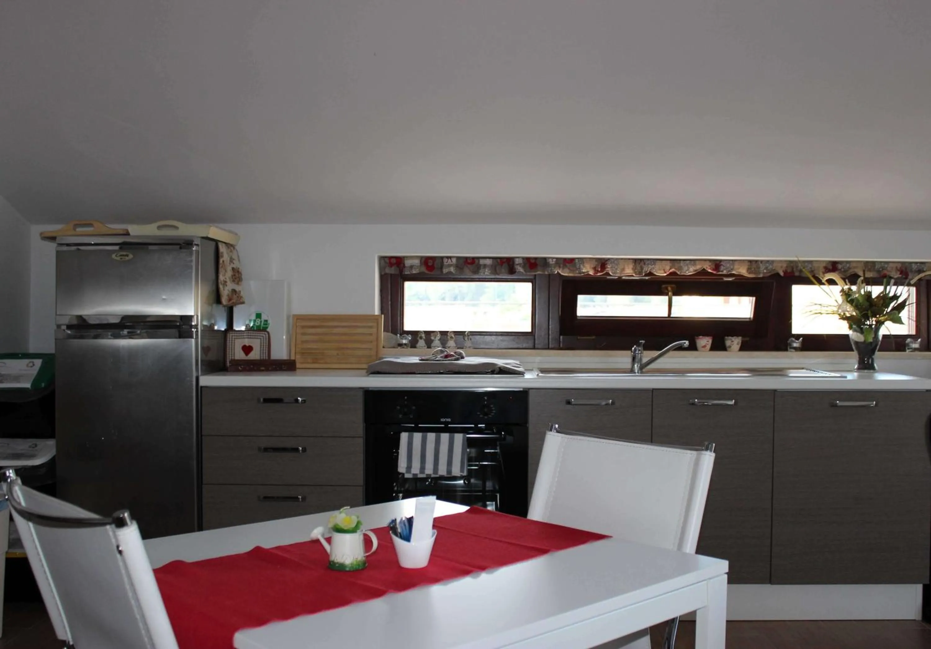 Communal lounge/ TV room in Magico Riposo