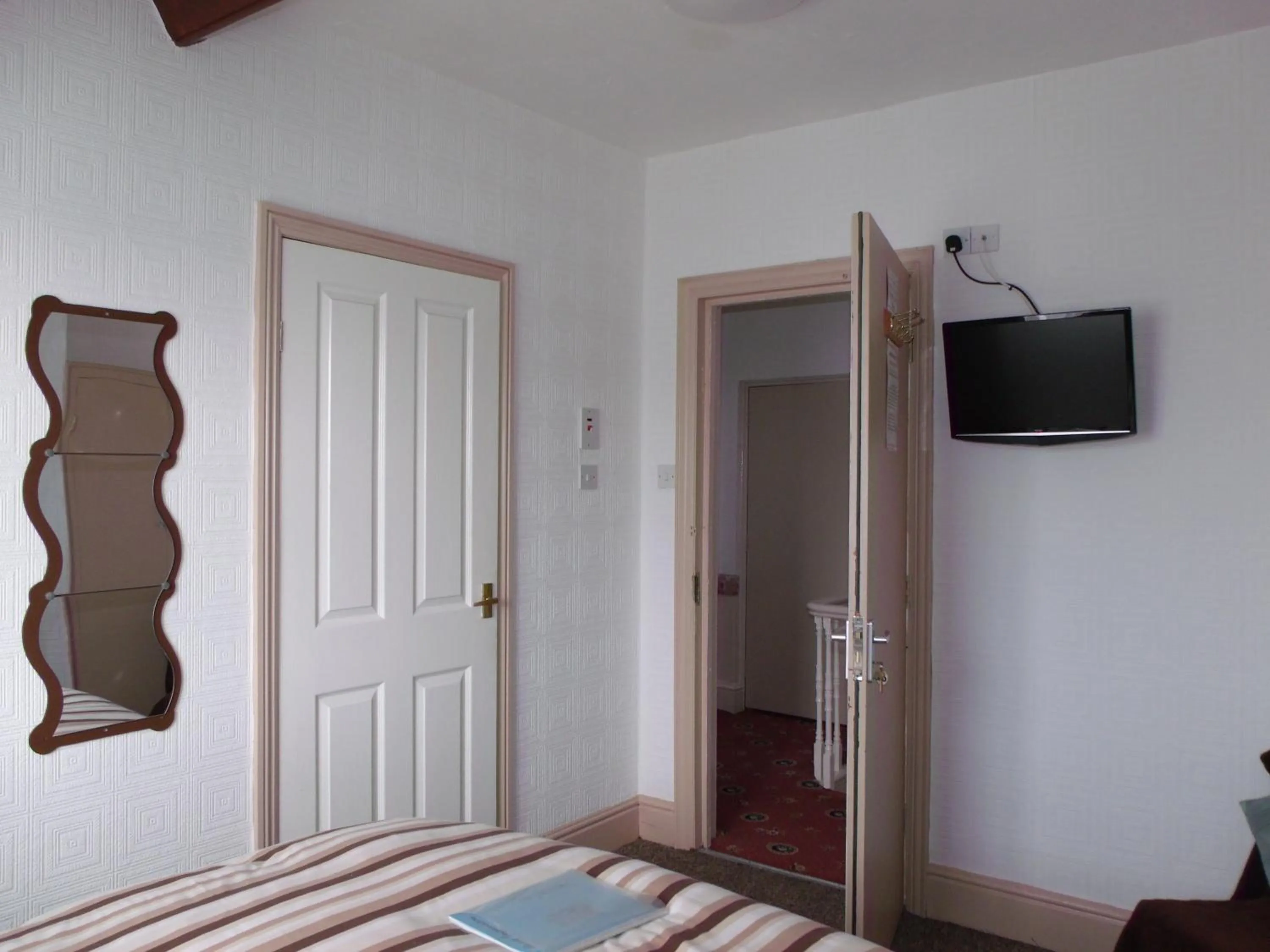 Bed in Jasmine Guest House