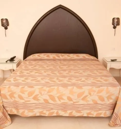Bed in Baia del Mar Beach Boutique Hotel
