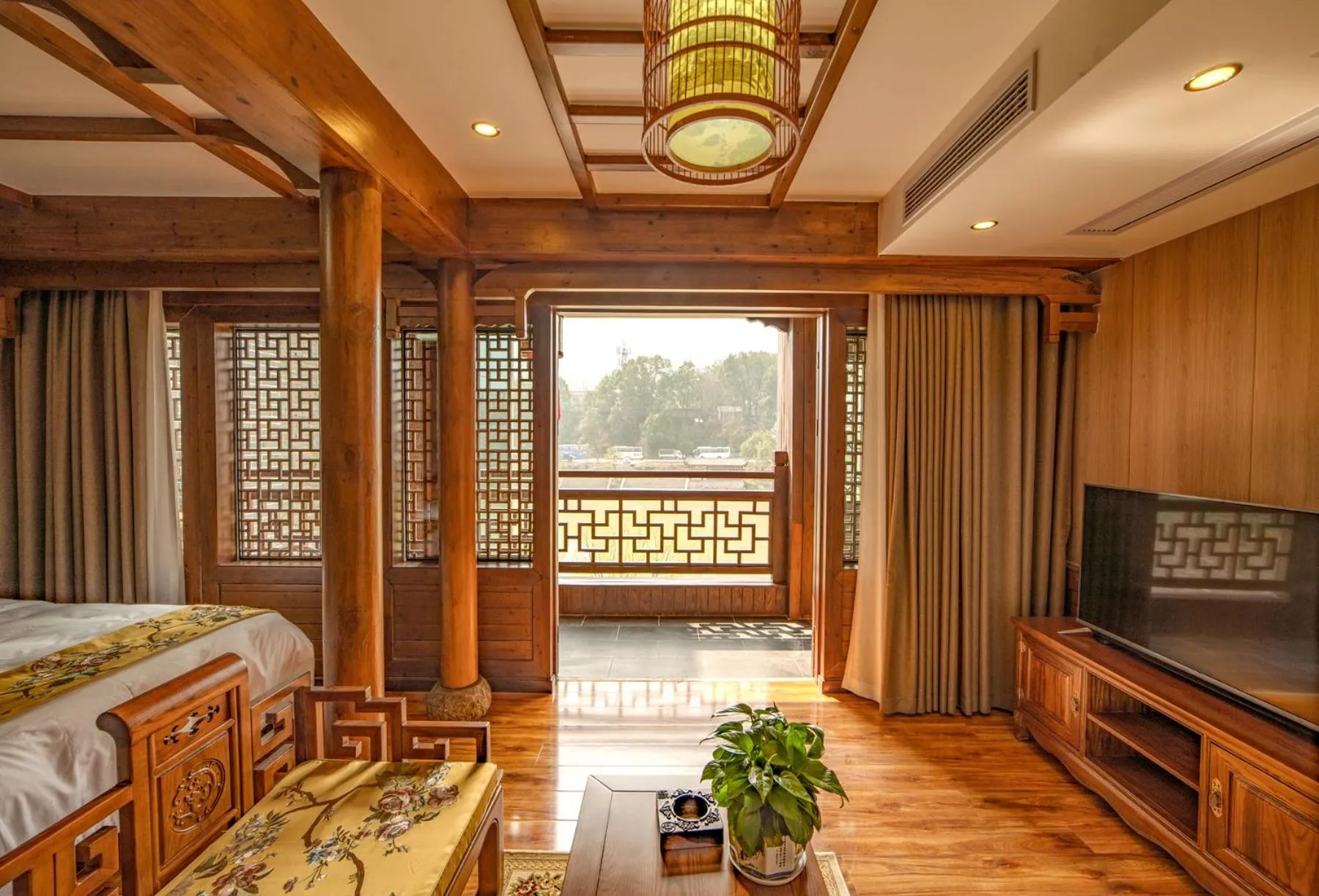 Communal lounge/ TV room, Bed in Lee's Boutique Resort