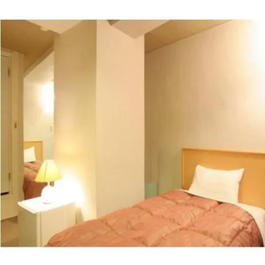 Bed in Takasaki Ekimae Plaza Hotel