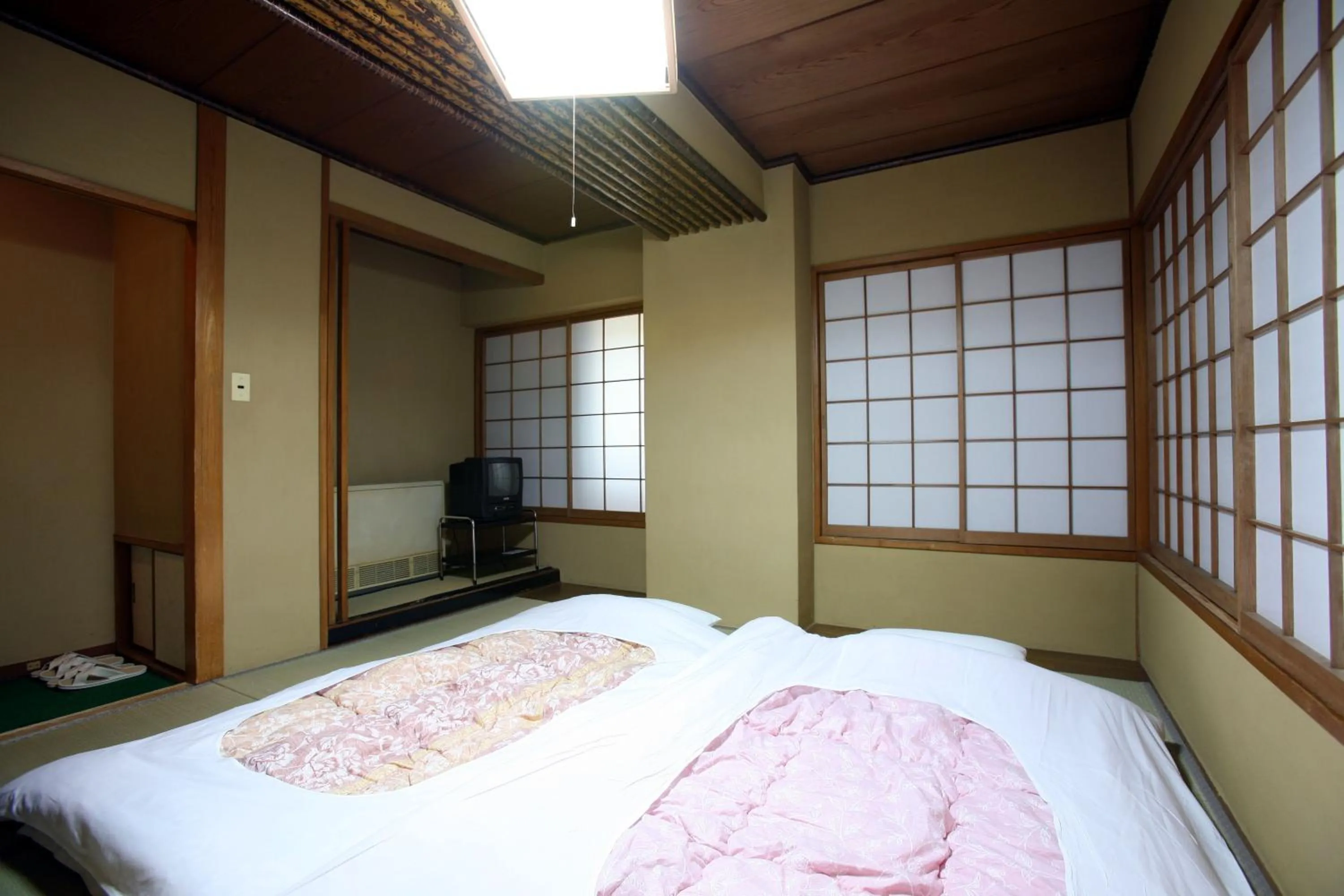 Bed in Takasaki Ekimae Plaza Hotel