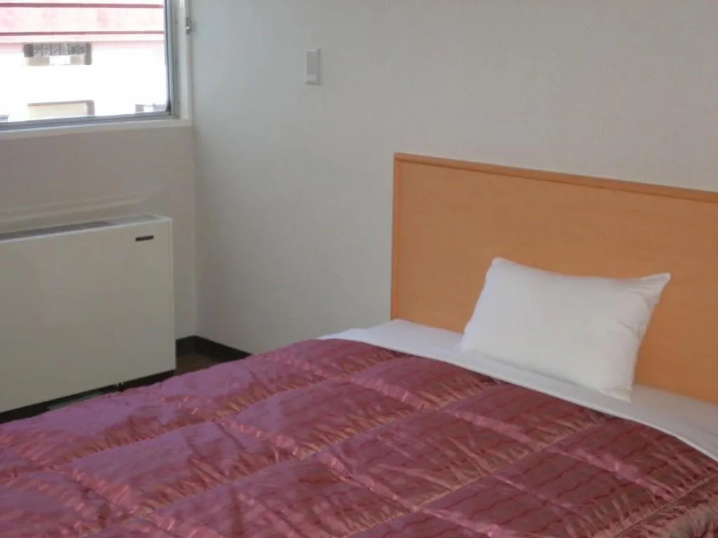 Bed in Takasaki Ekimae Plaza Hotel