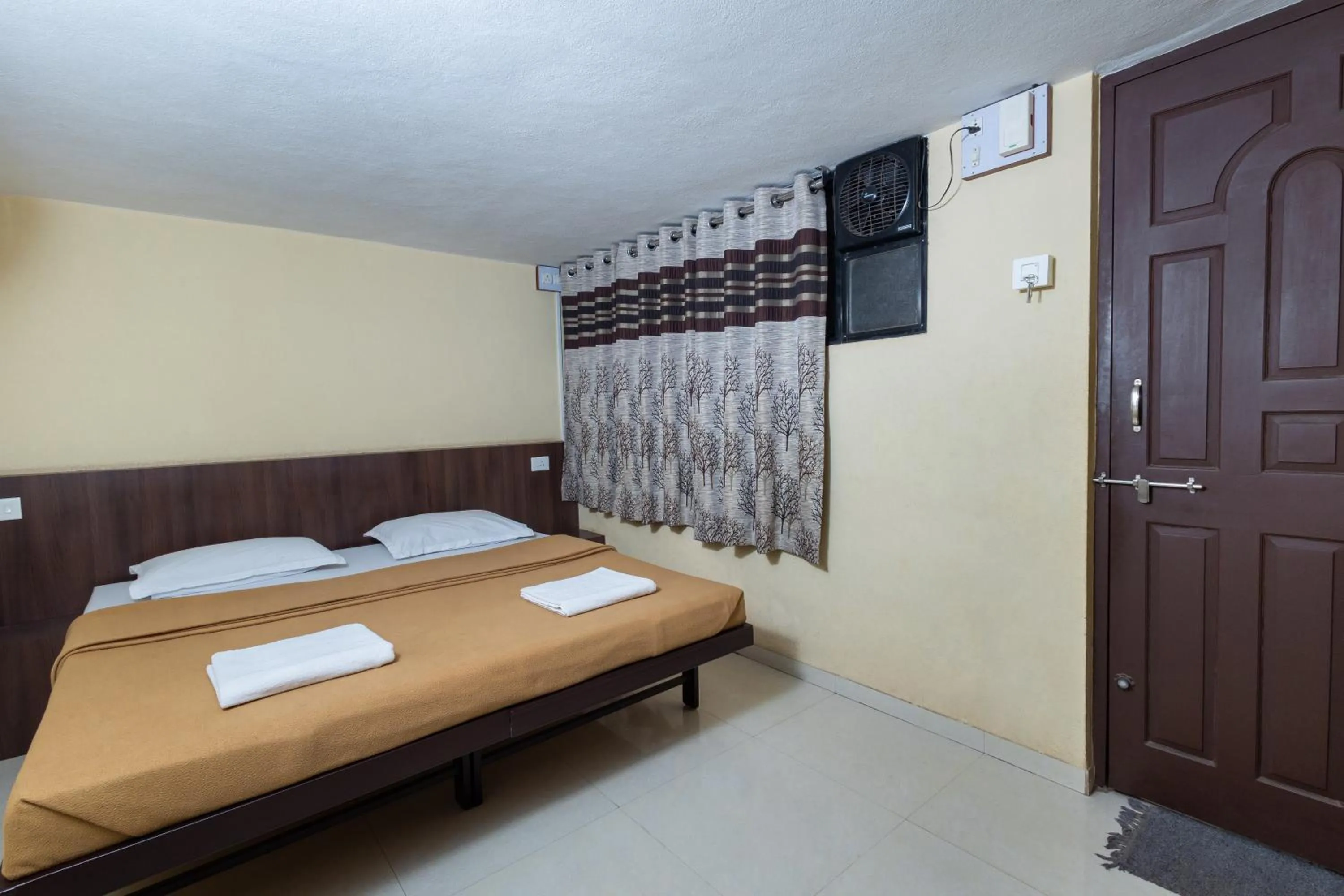 Bed in Hotel Ambika