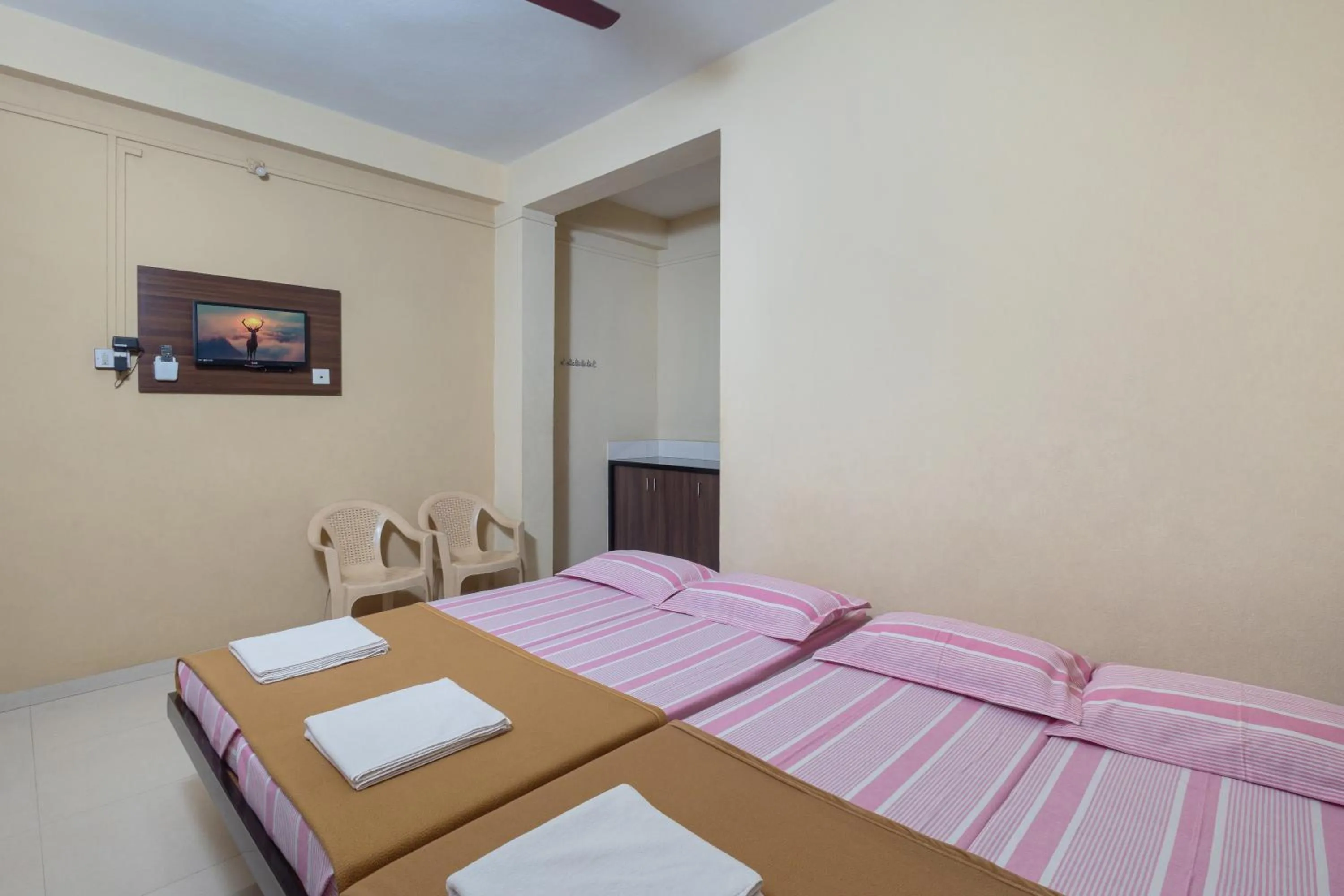 Bed in Hotel Ambika
