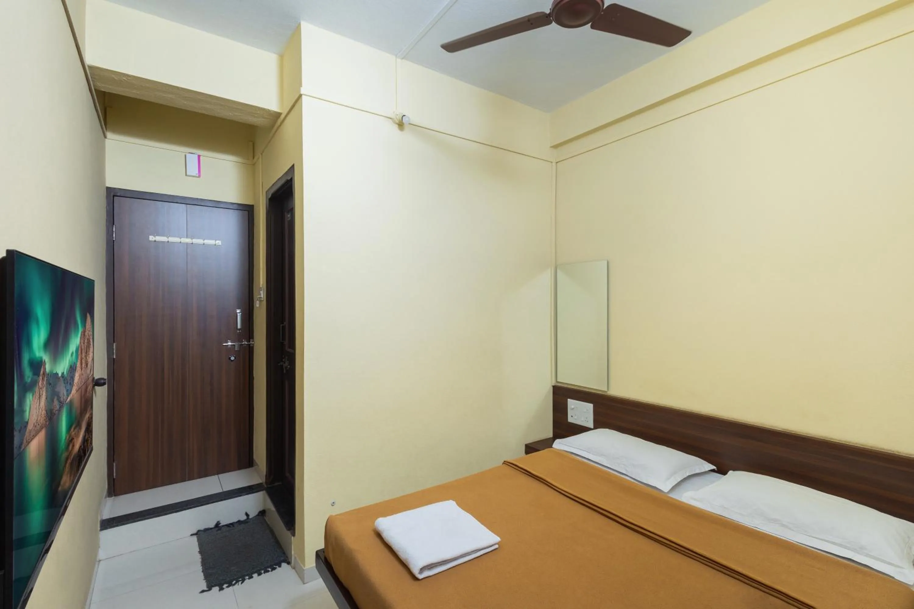 Bed in Hotel Ambika