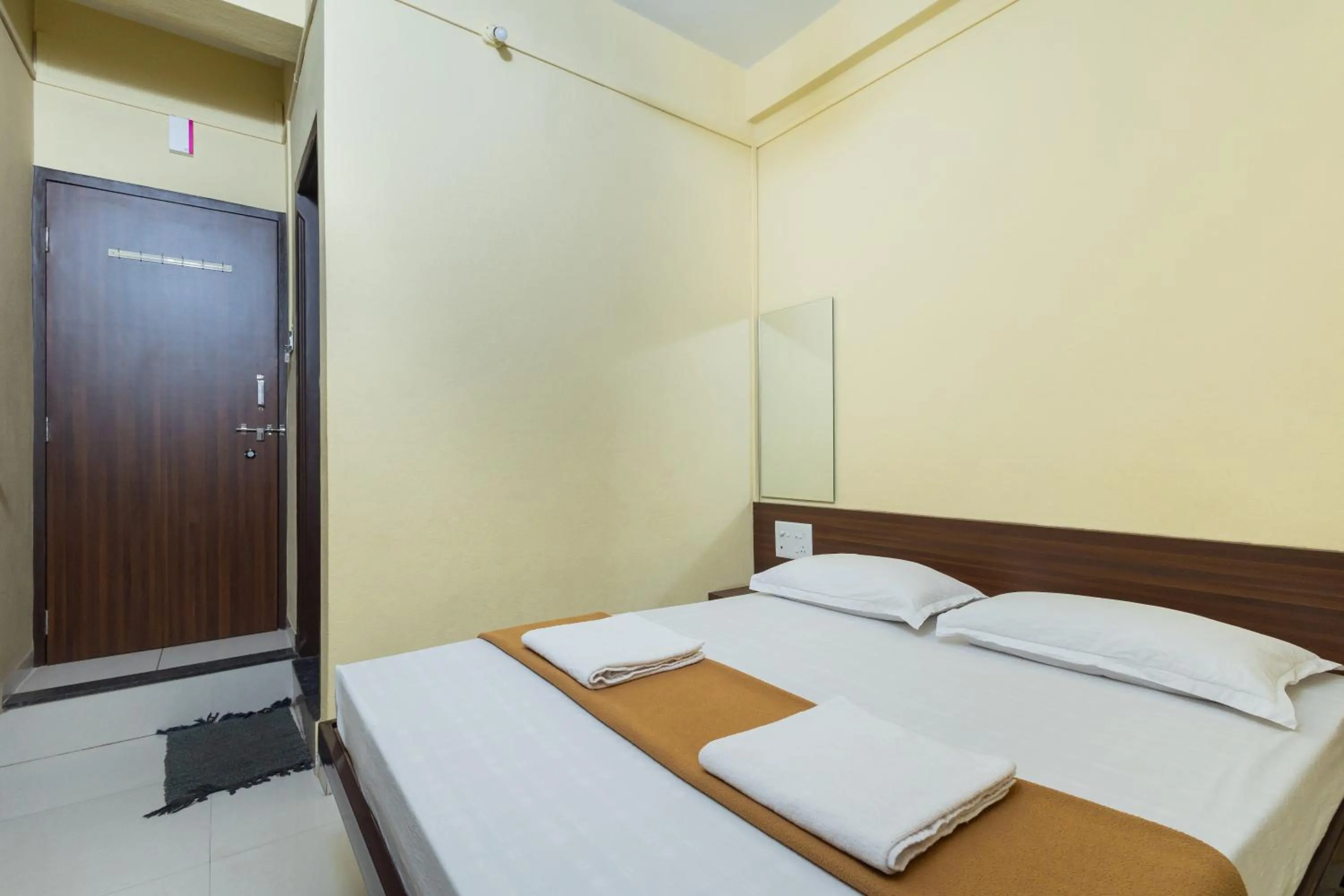 Bed in Hotel Ambika