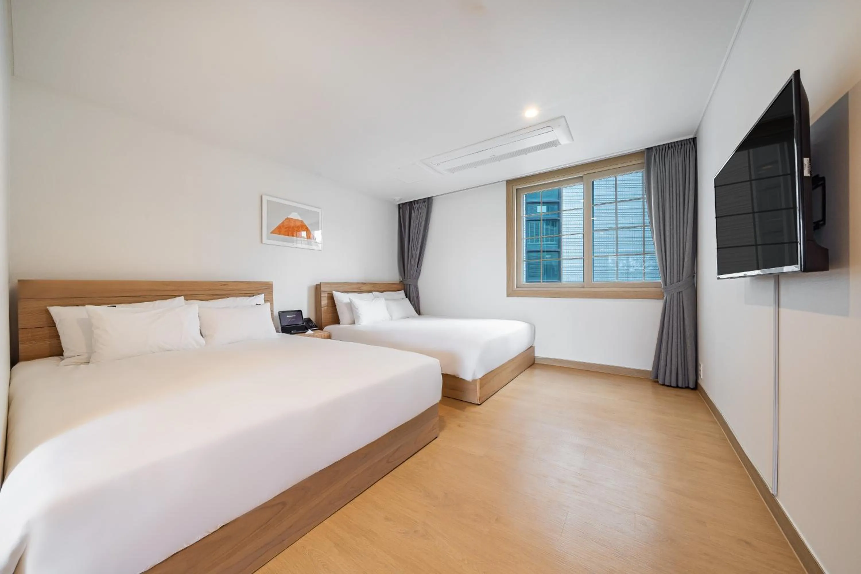 Bed in Heyy Seogwipo Hotel