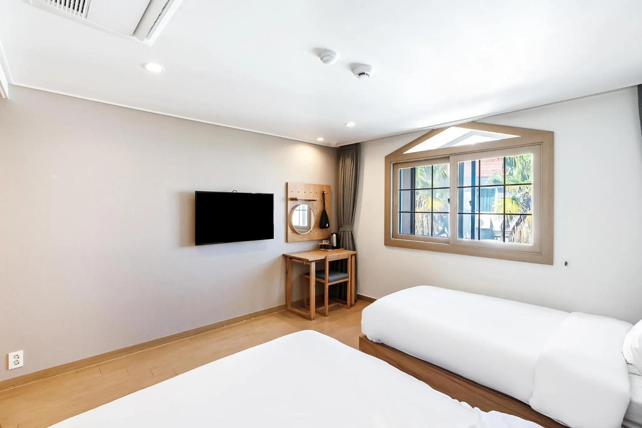 Bed in Heyy Seogwipo Hotel