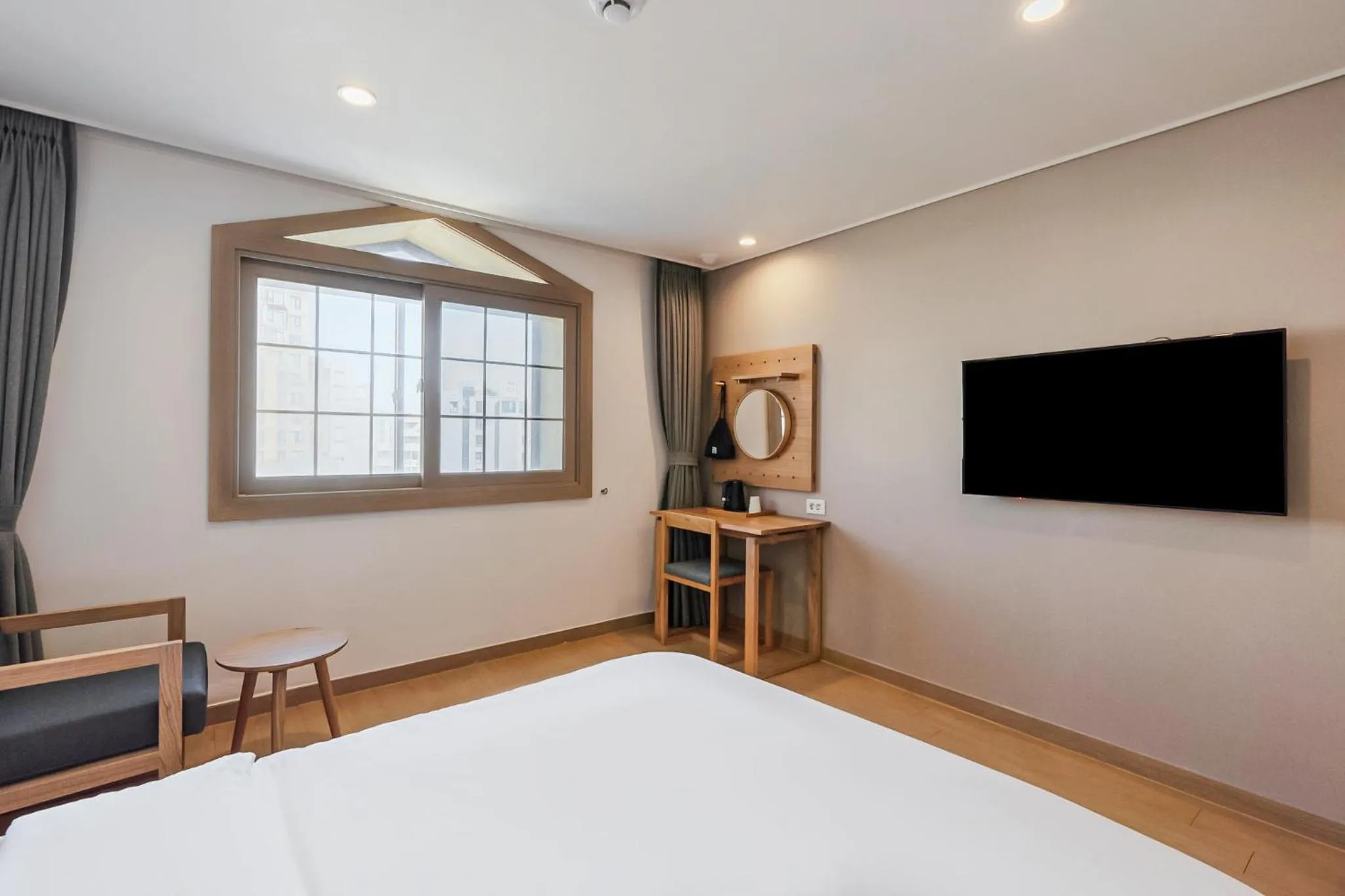 Bed in Heyy Seogwipo Hotel