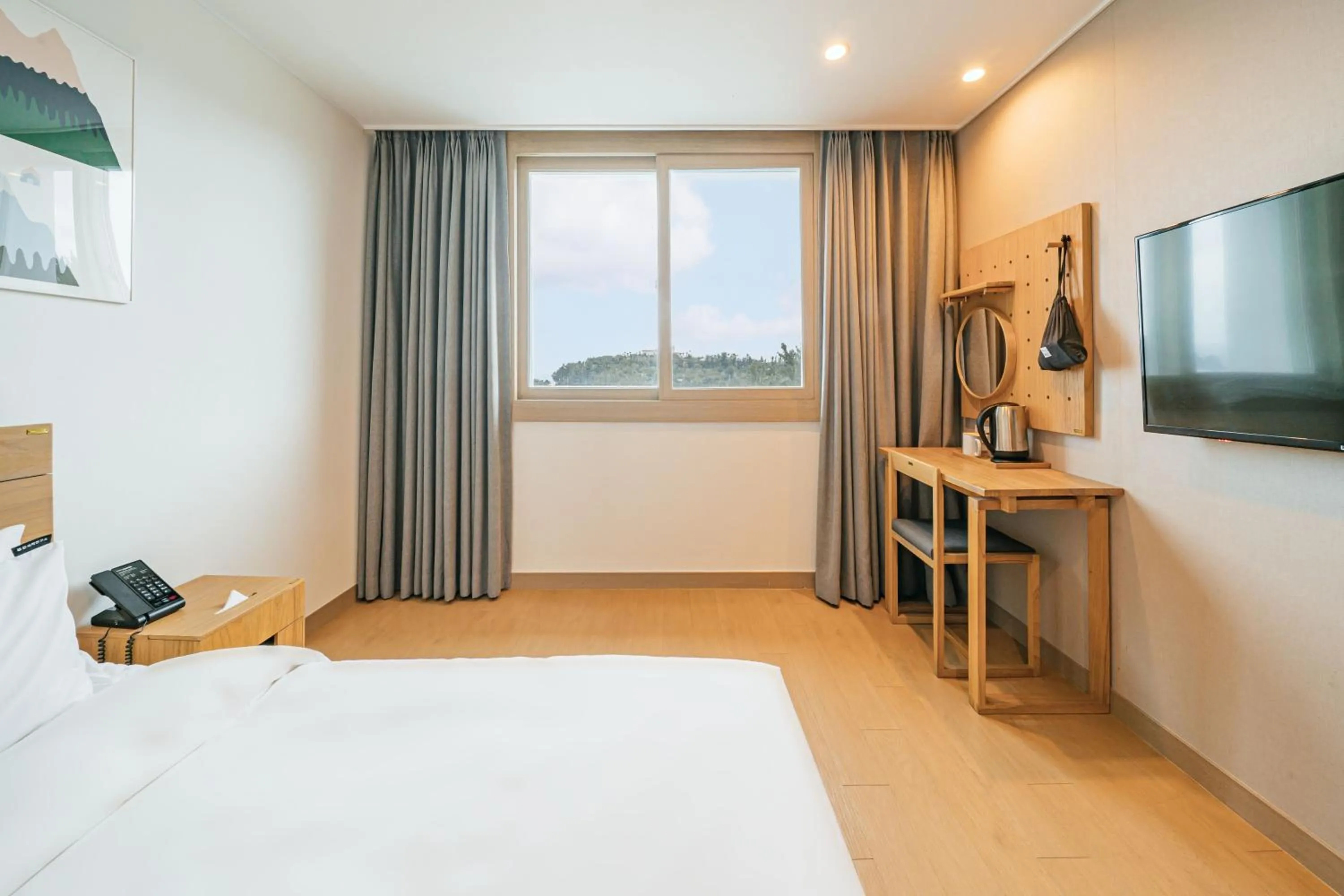 Bed in Heyy Seogwipo Hotel