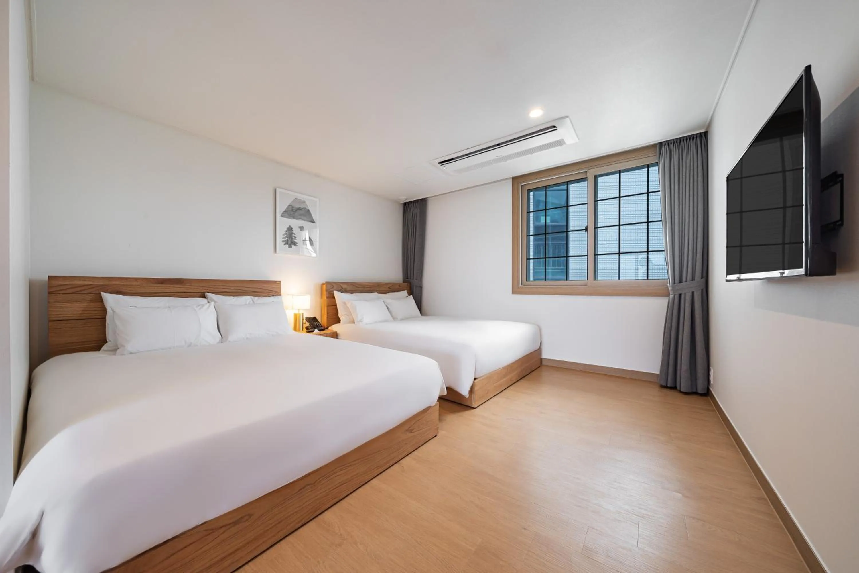 Bed in Heyy Seogwipo Hotel