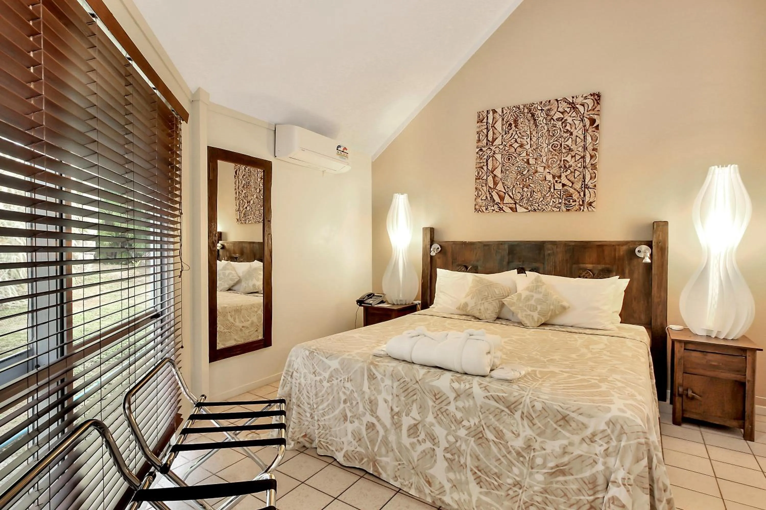 Bed in Crown Beach Resort & Spa