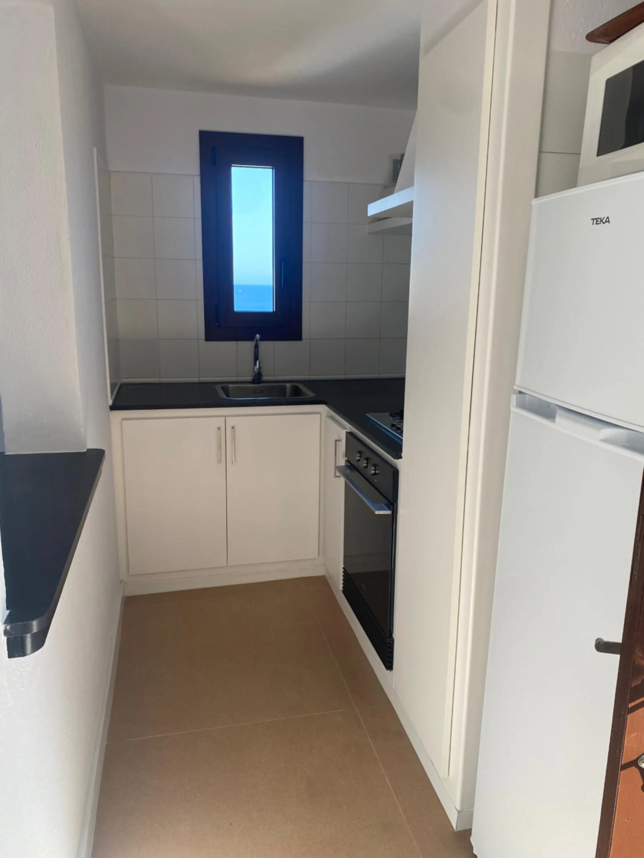 Kitchen or kitchenette in Apartamentos Sa Cornisa