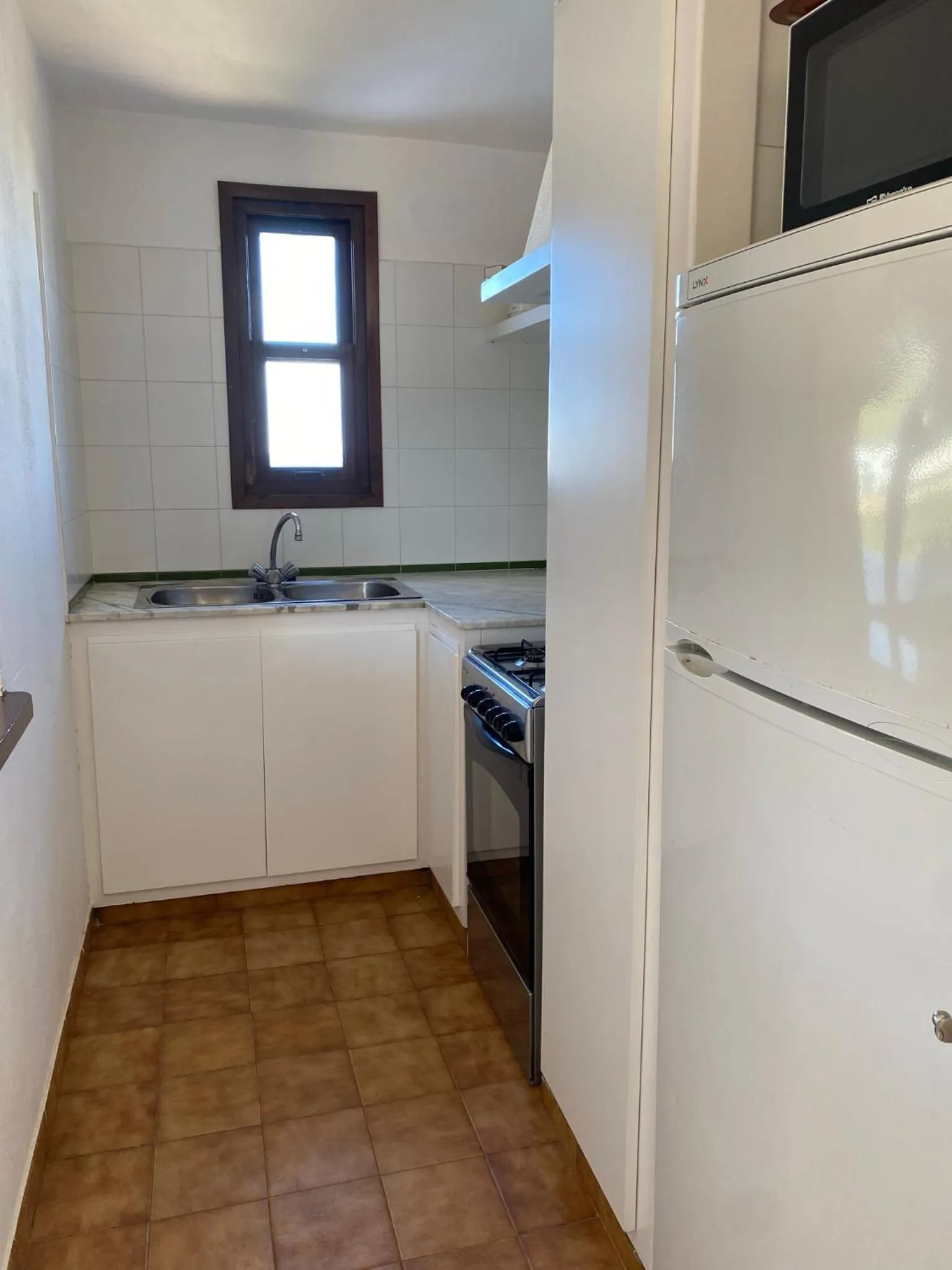 Kitchen or kitchenette in Apartamentos Sa Cornisa
