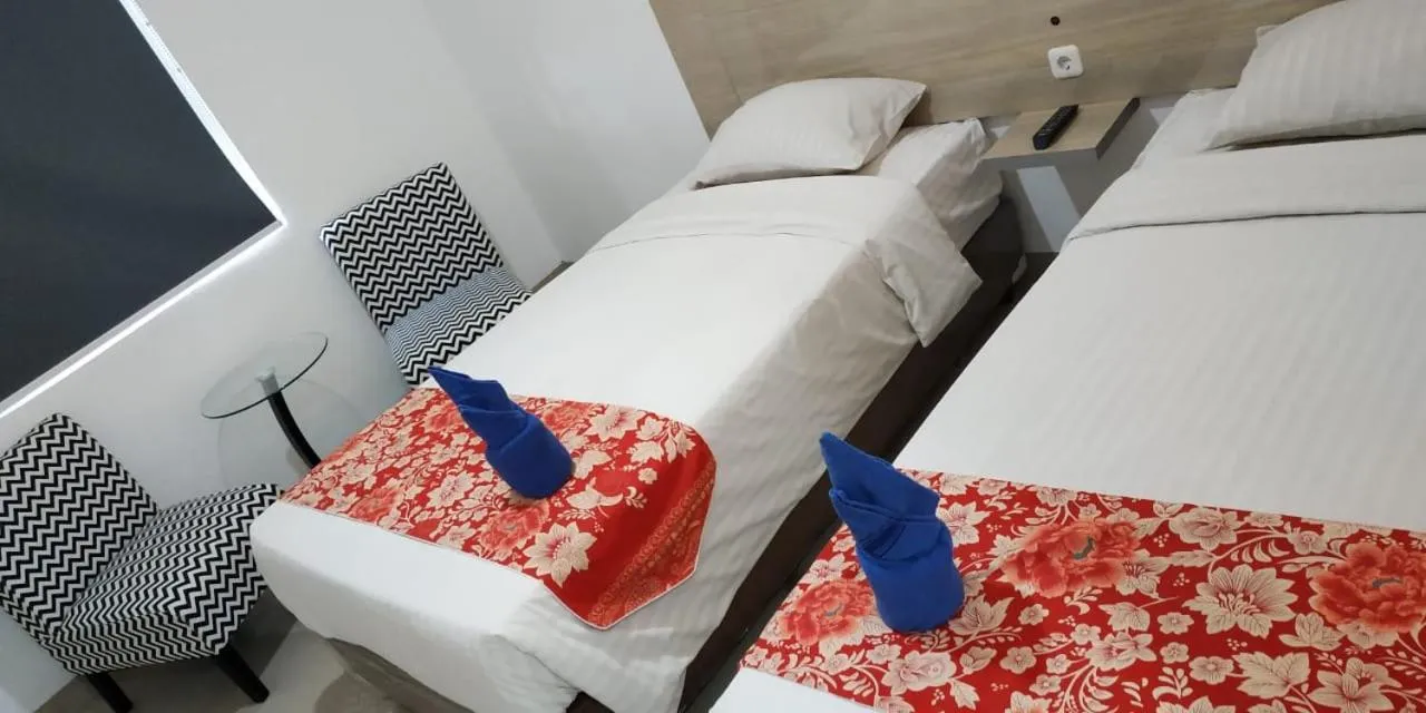 Bed in Mel's Inn Manado