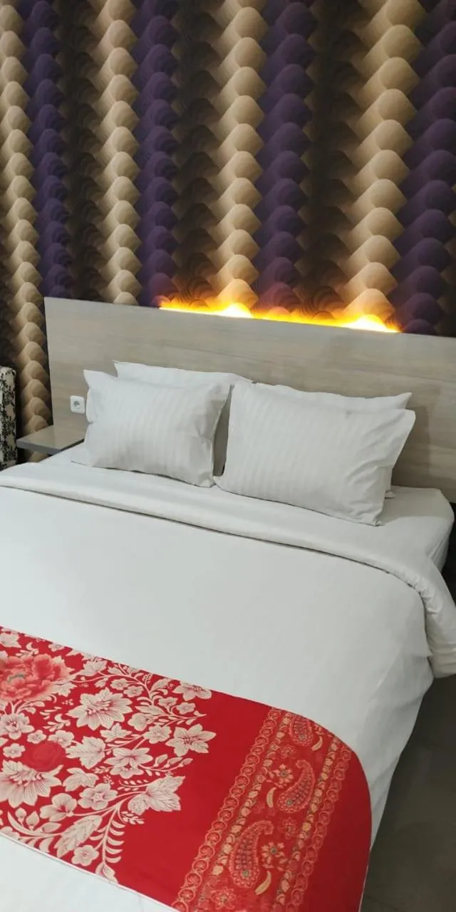 Bed in Mel's Inn Manado