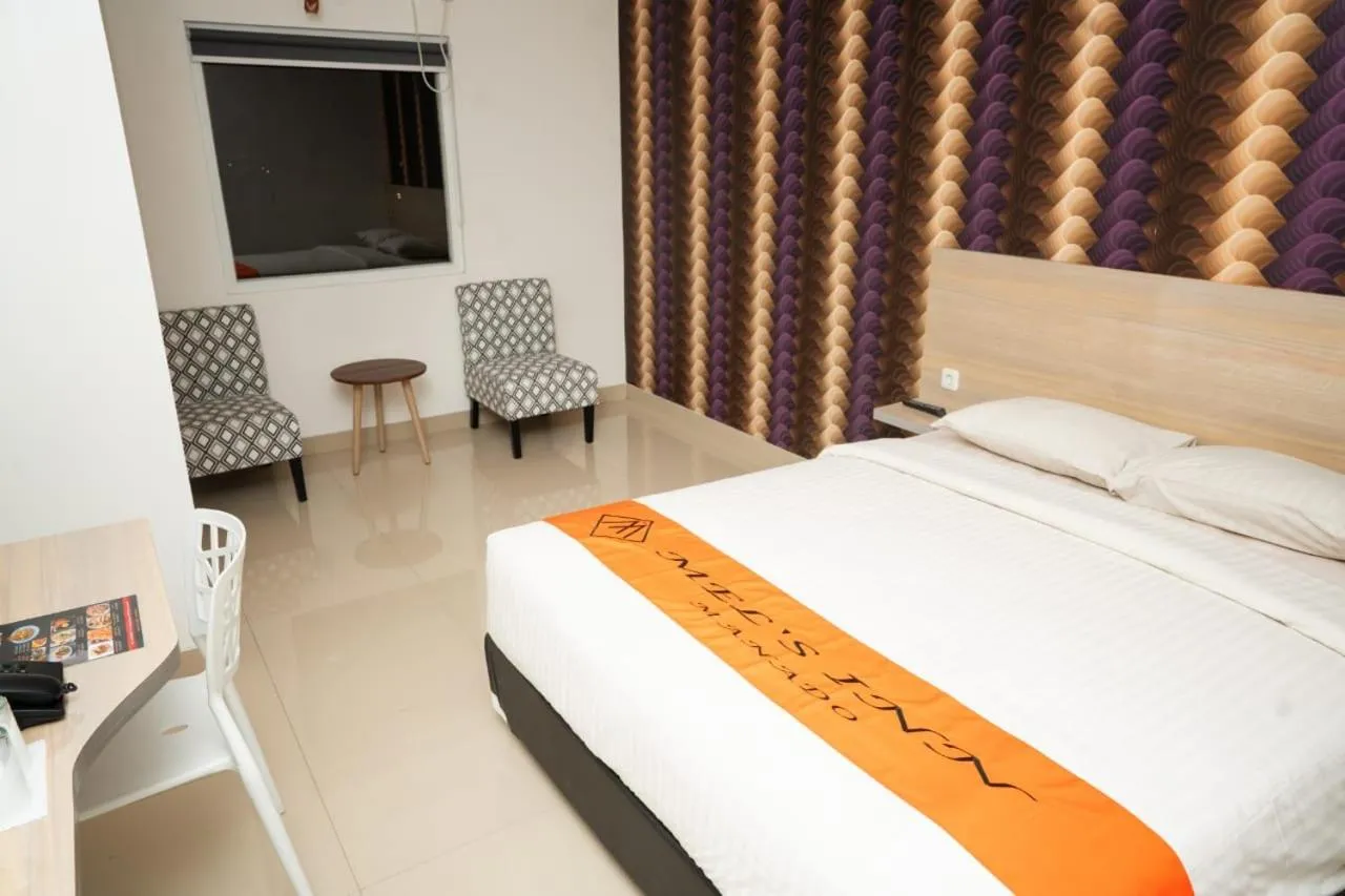 Bed in Mel's Inn Manado